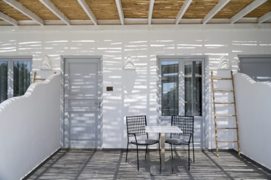 a table and chairs on a deck