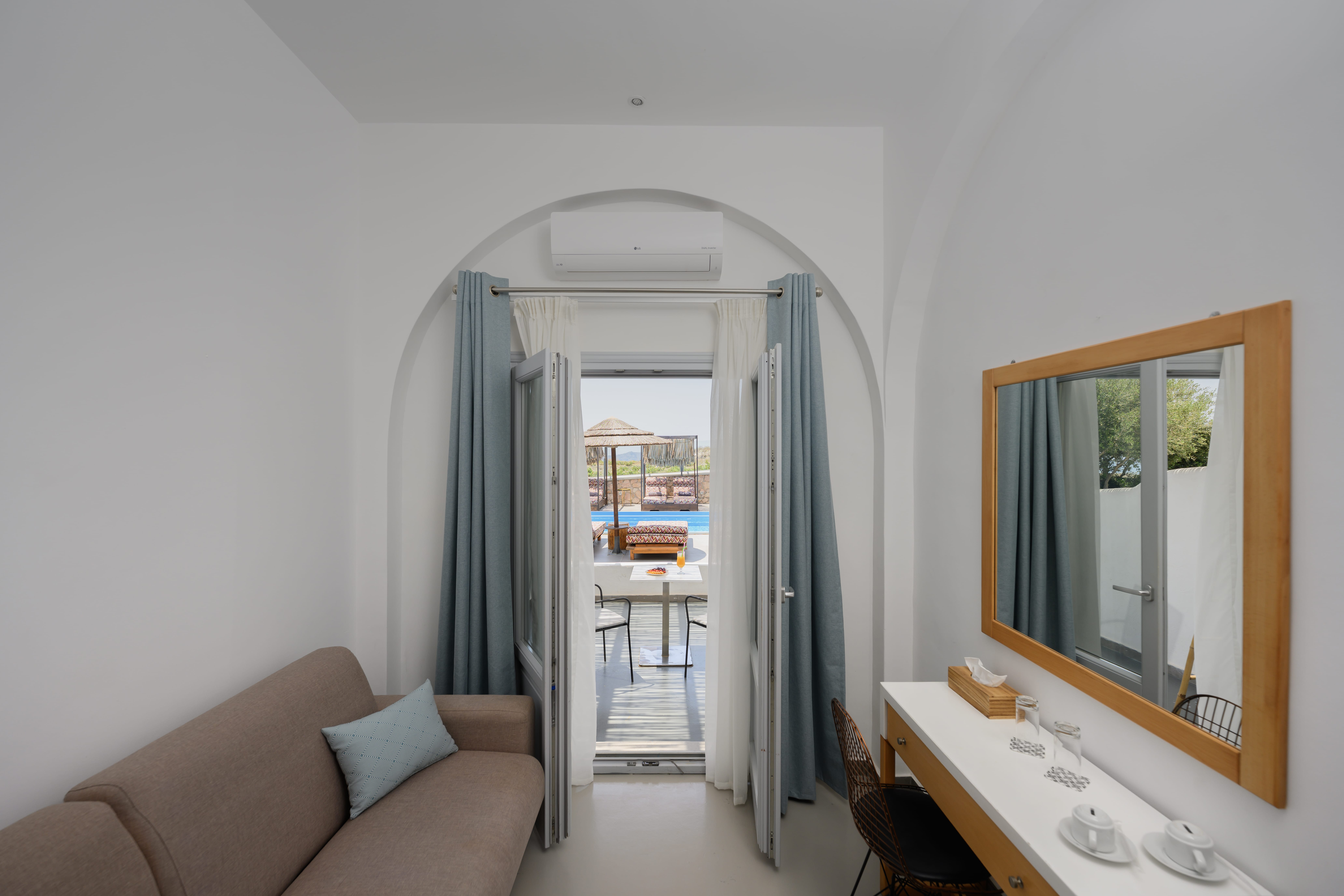 a living room with a large mirror