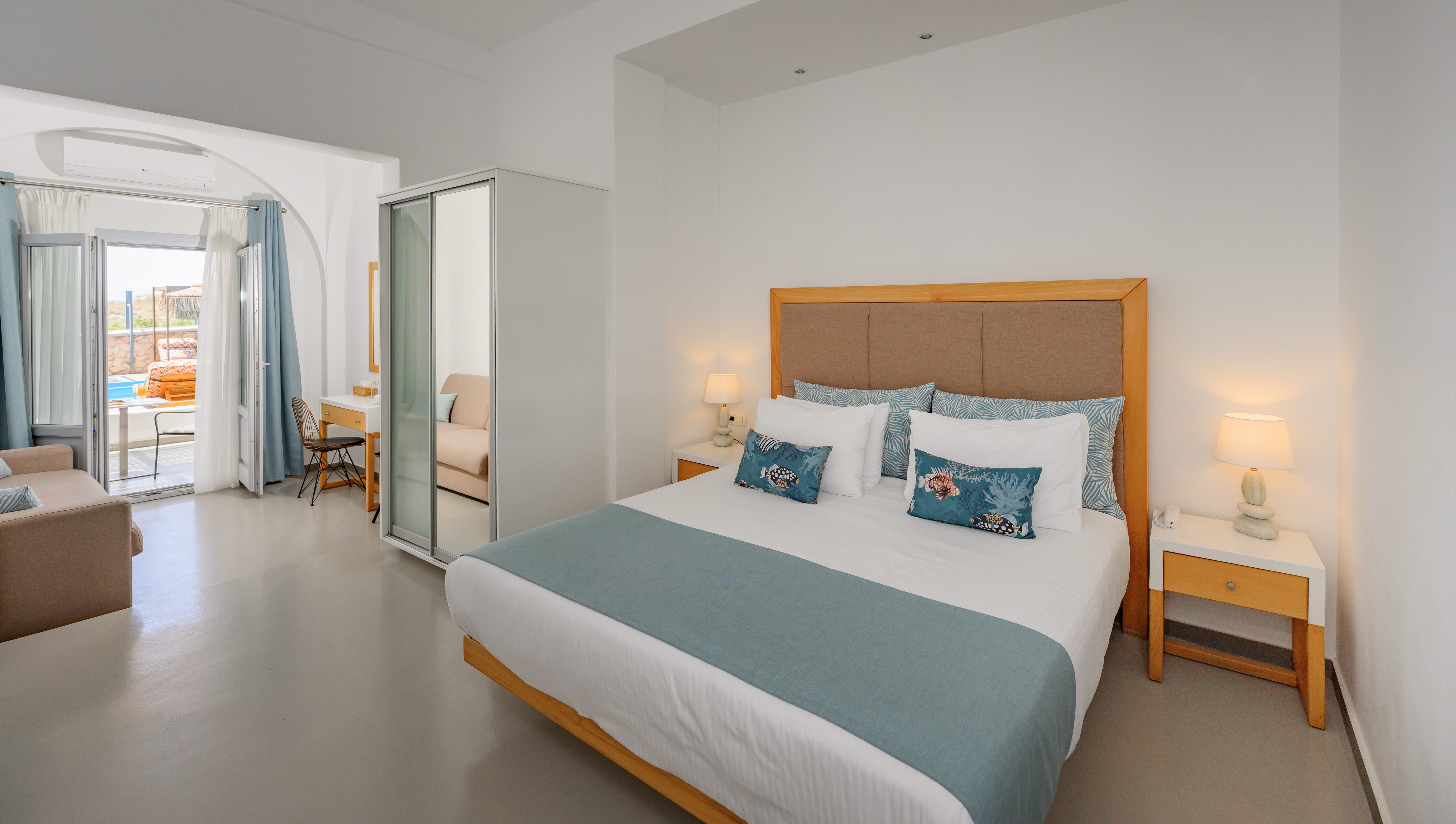 a bedroom with a bed and a lamp