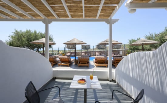 a patio with a table and chairs