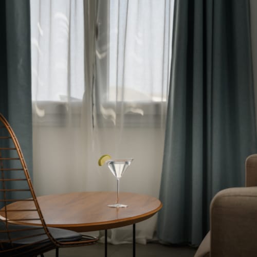 a chair and a table in a room with a window
