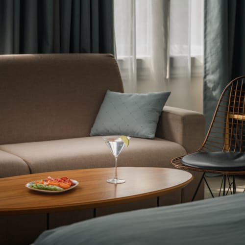 a couch with a table and chairs
