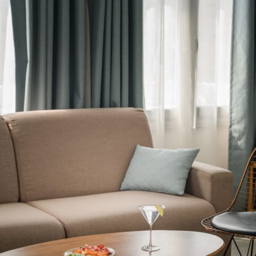 a couch with a table and chairs
