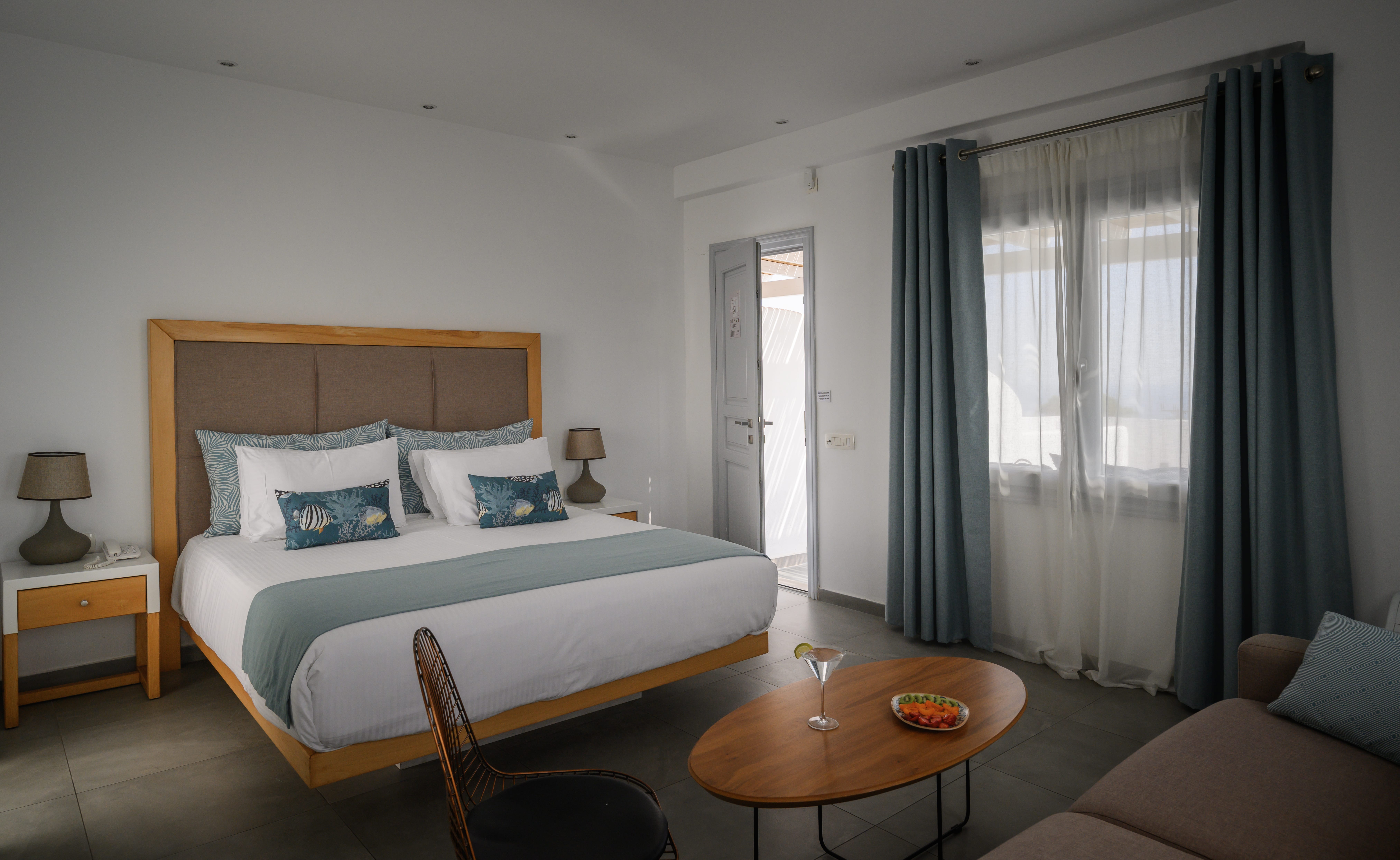 a bedroom with a bed and a table