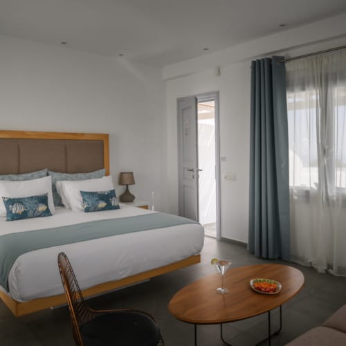 a bedroom with a bed and a table