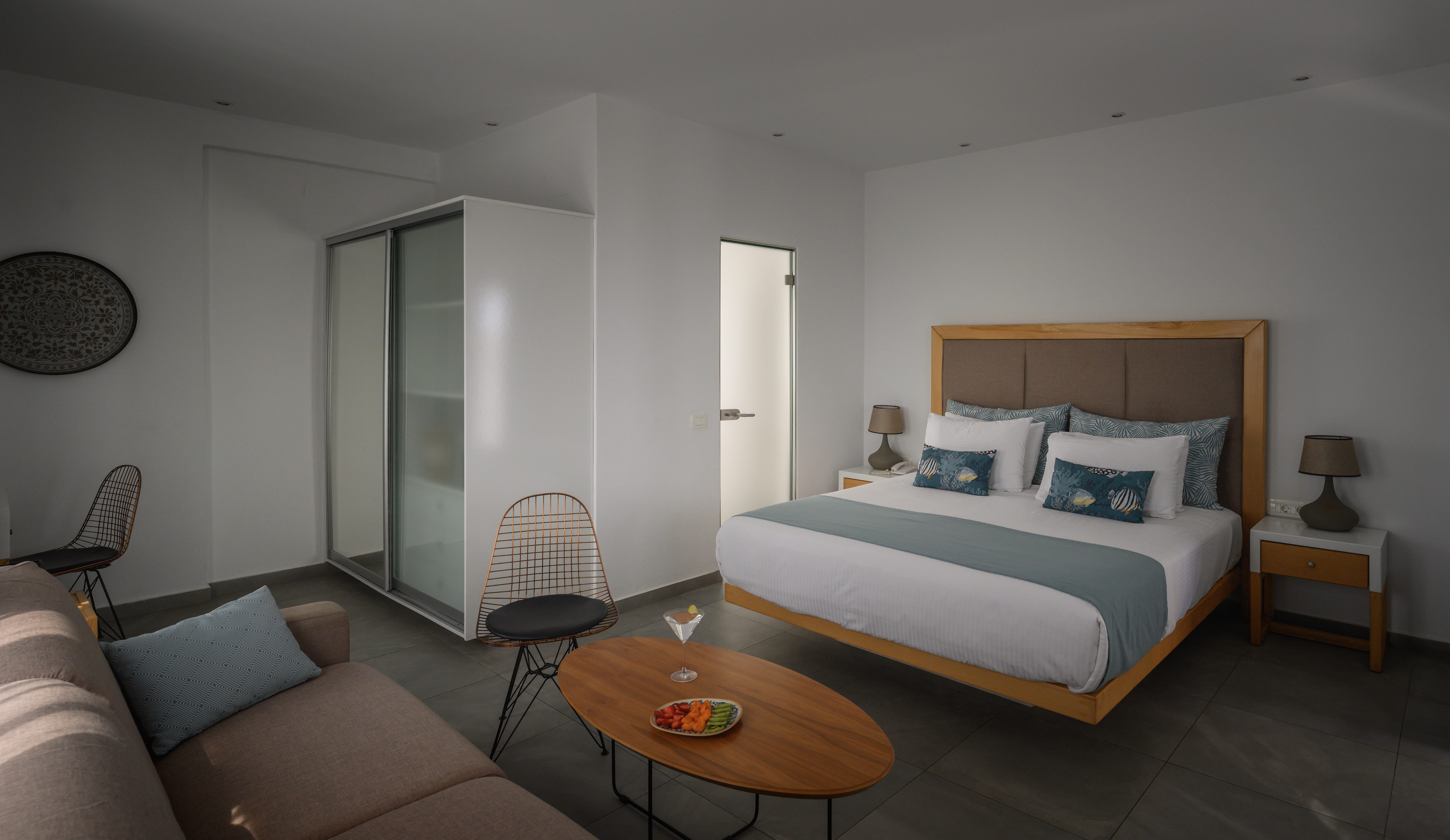 a bedroom with a bed and a coffee table