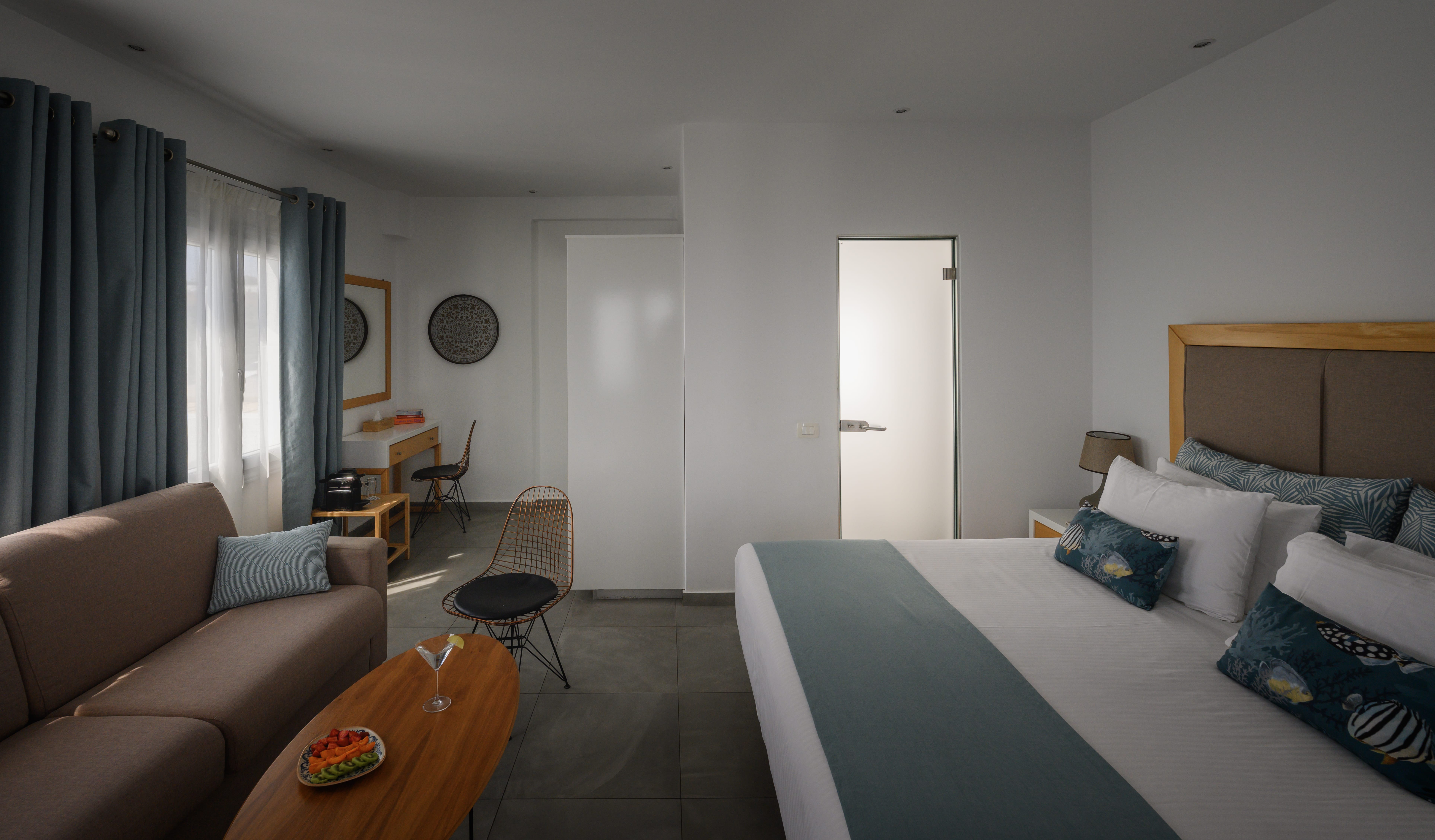 a bedroom with a bed and couch