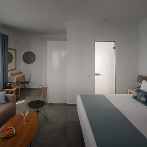 a bedroom with a bed and couch
