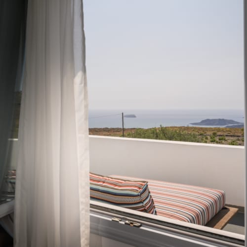 a window with a view of the ocean and land