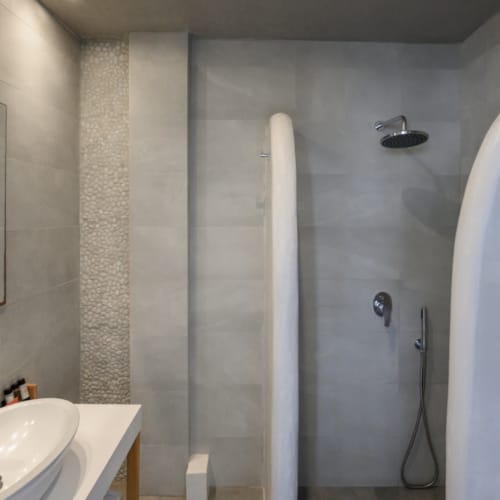 a bathroom with a shower and sink