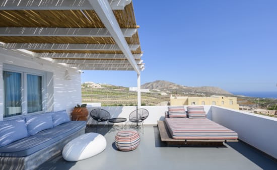 a deck with a pool and chairs