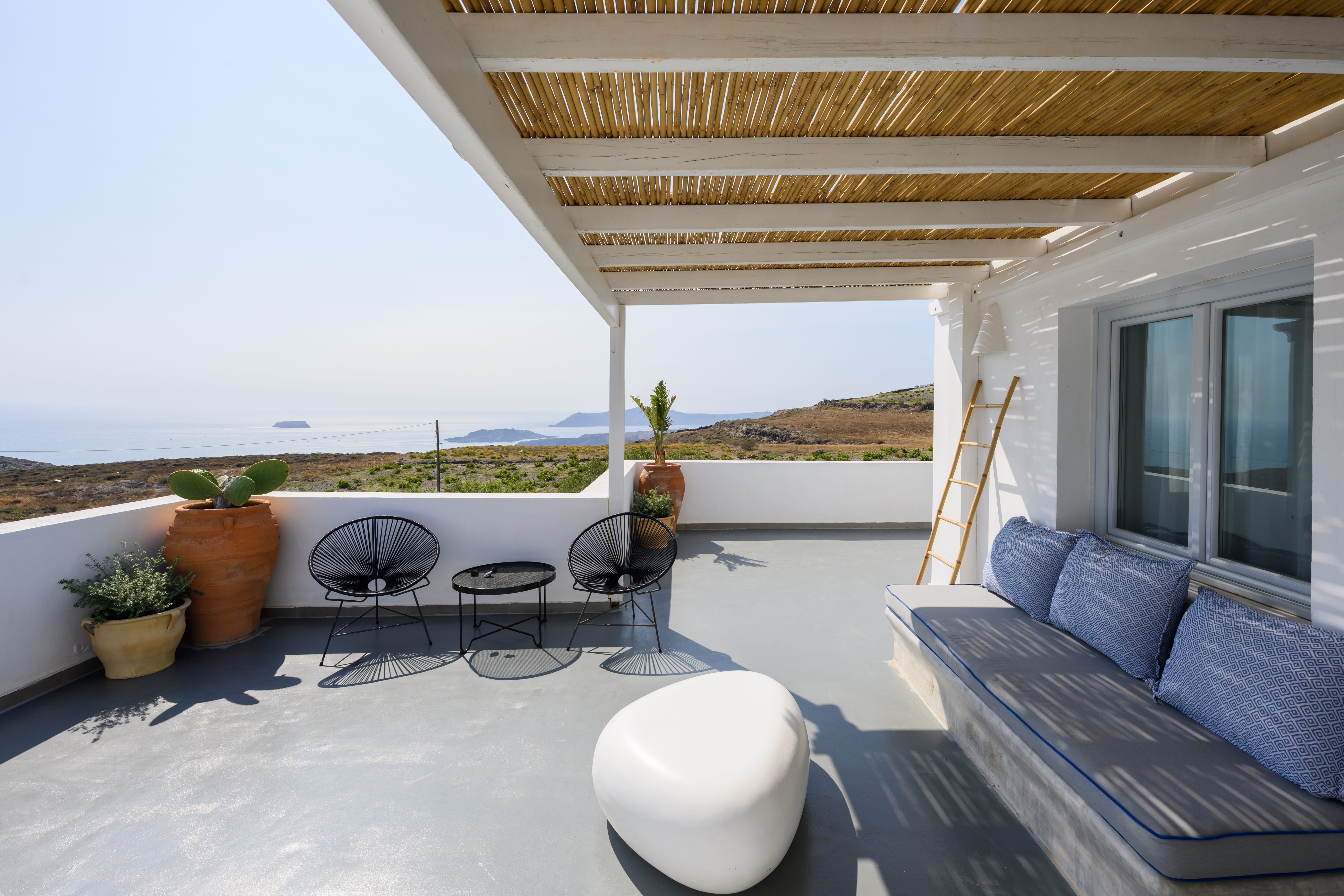 a patio with a table and chairs