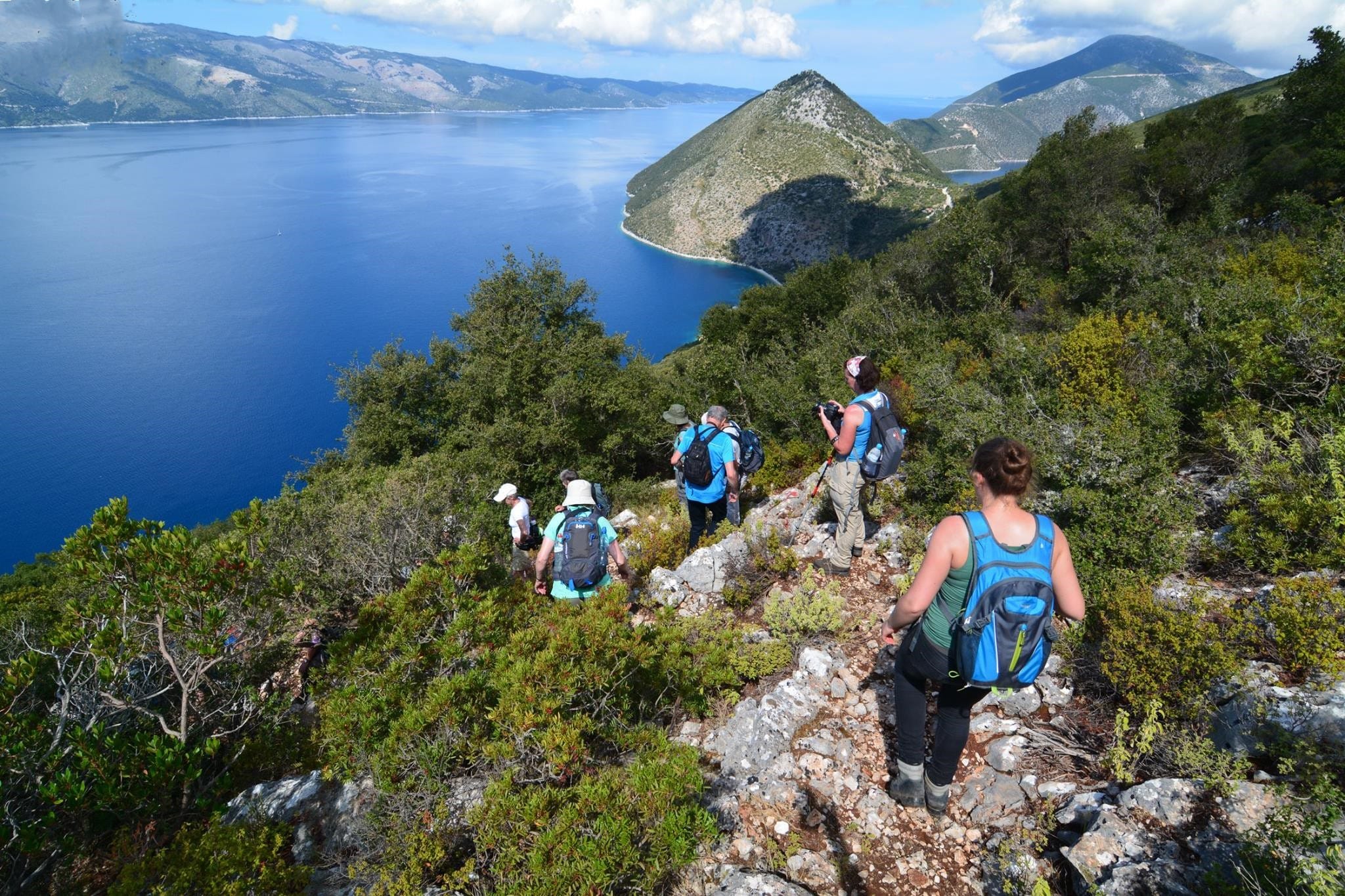 a group of people hiking on a mountain
