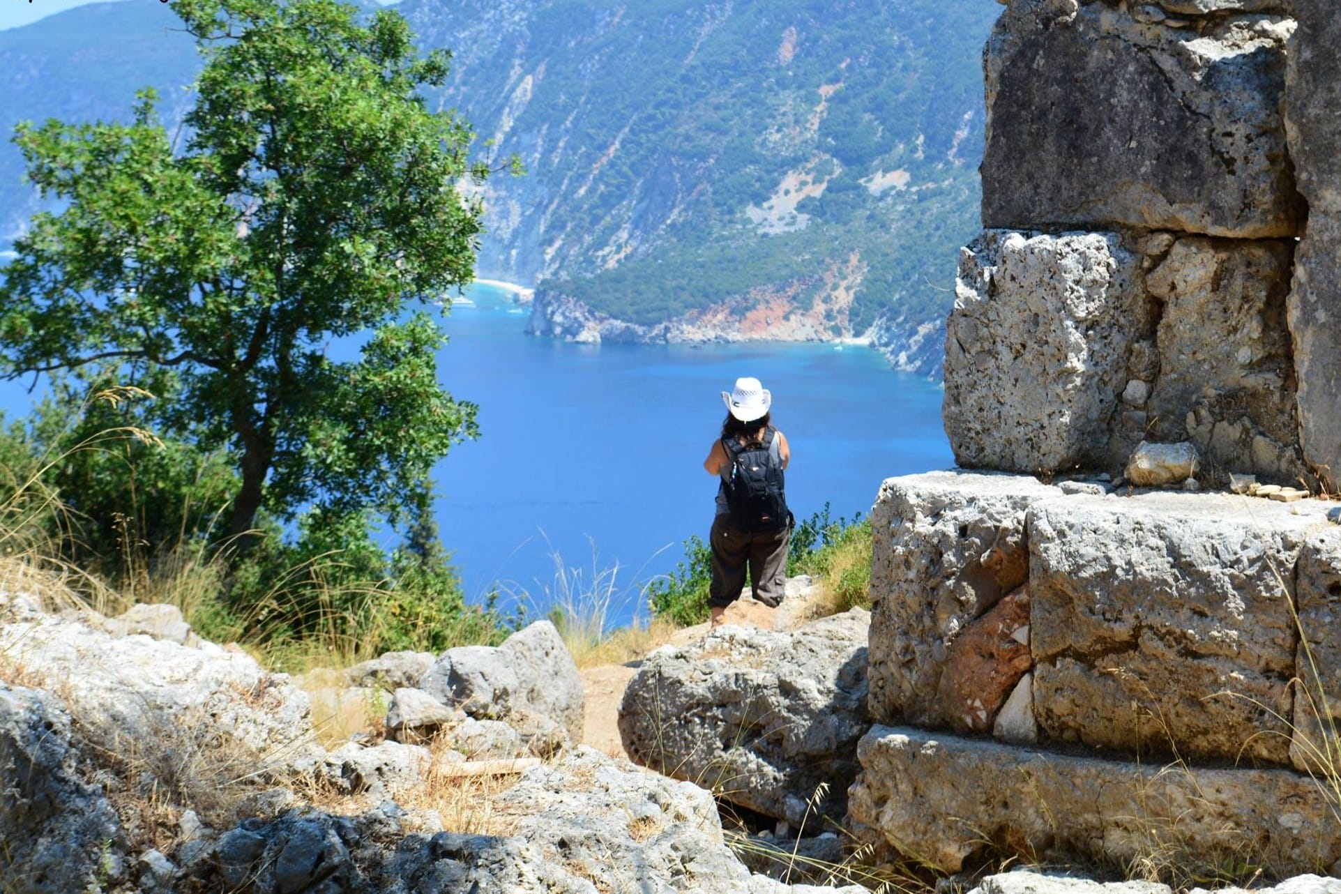 a person standing on a rock