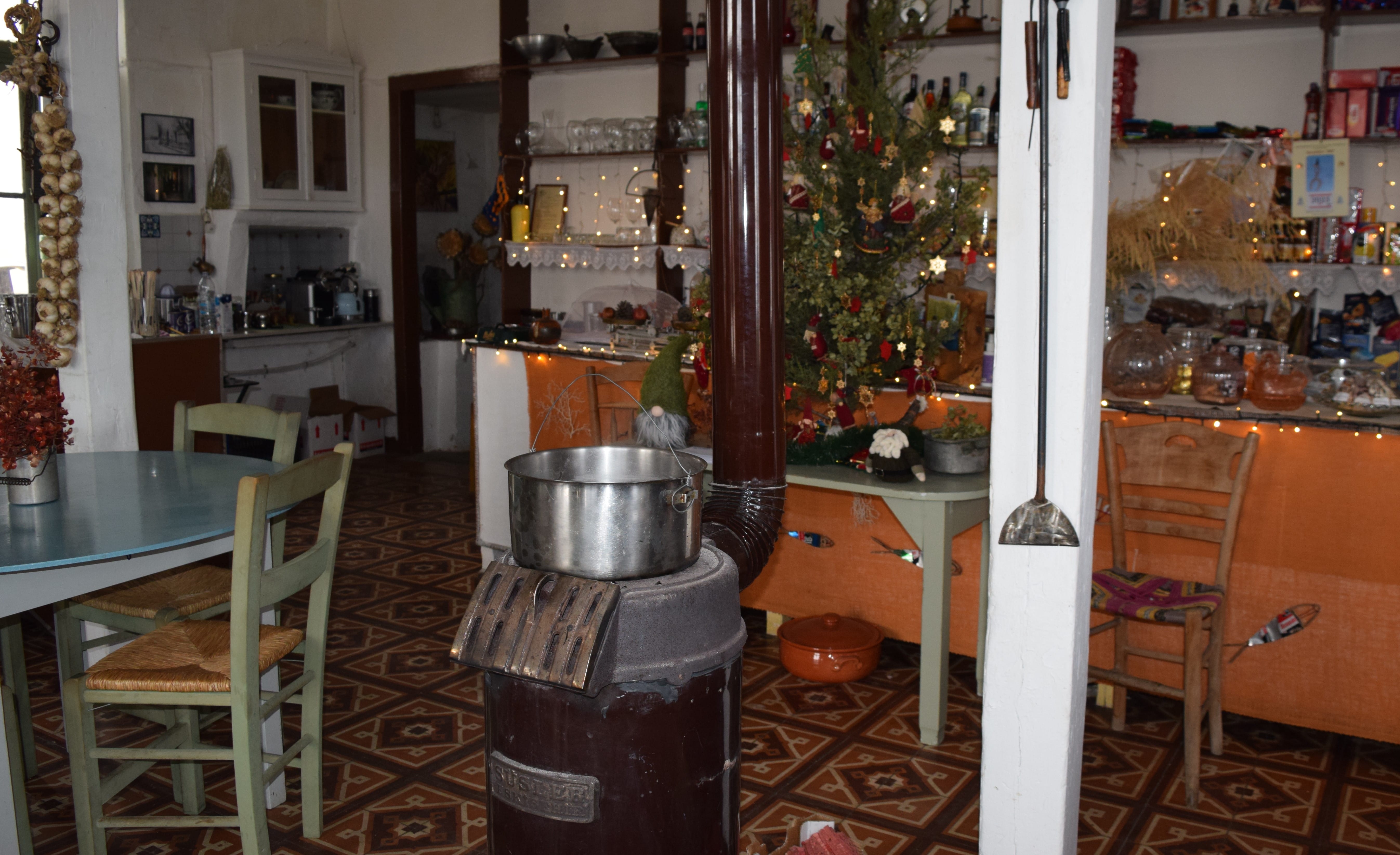 a kitchen with a table and chairs