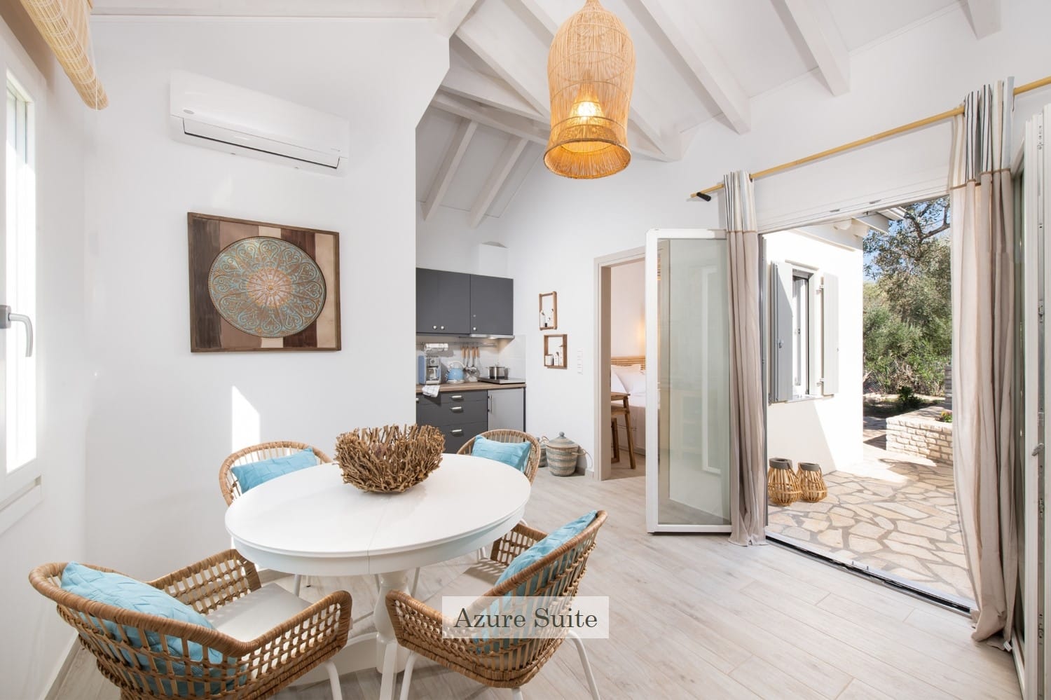 a living room with a table and chairs