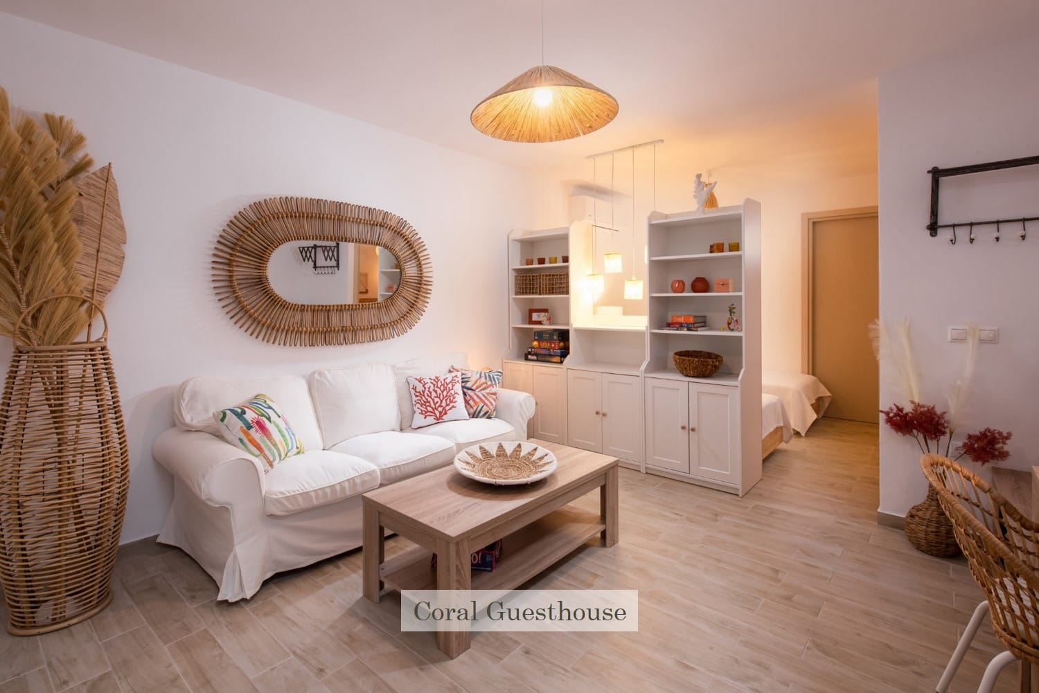 a living room with a white couch and a white table