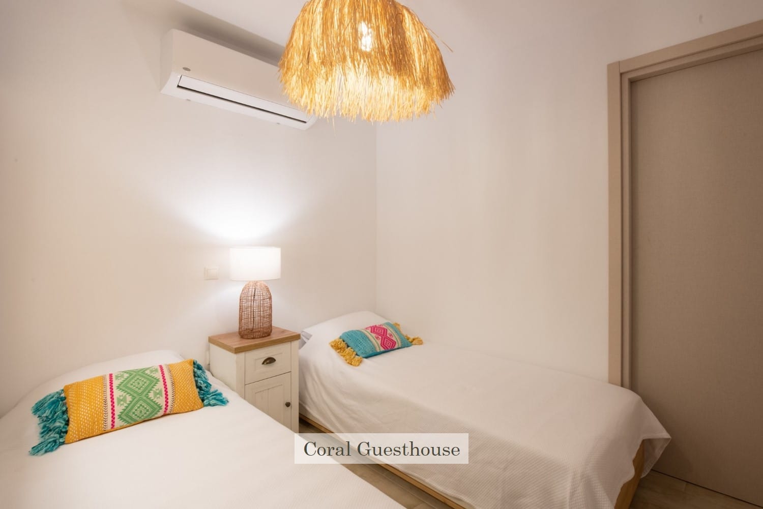 a room with a bed and a lamp