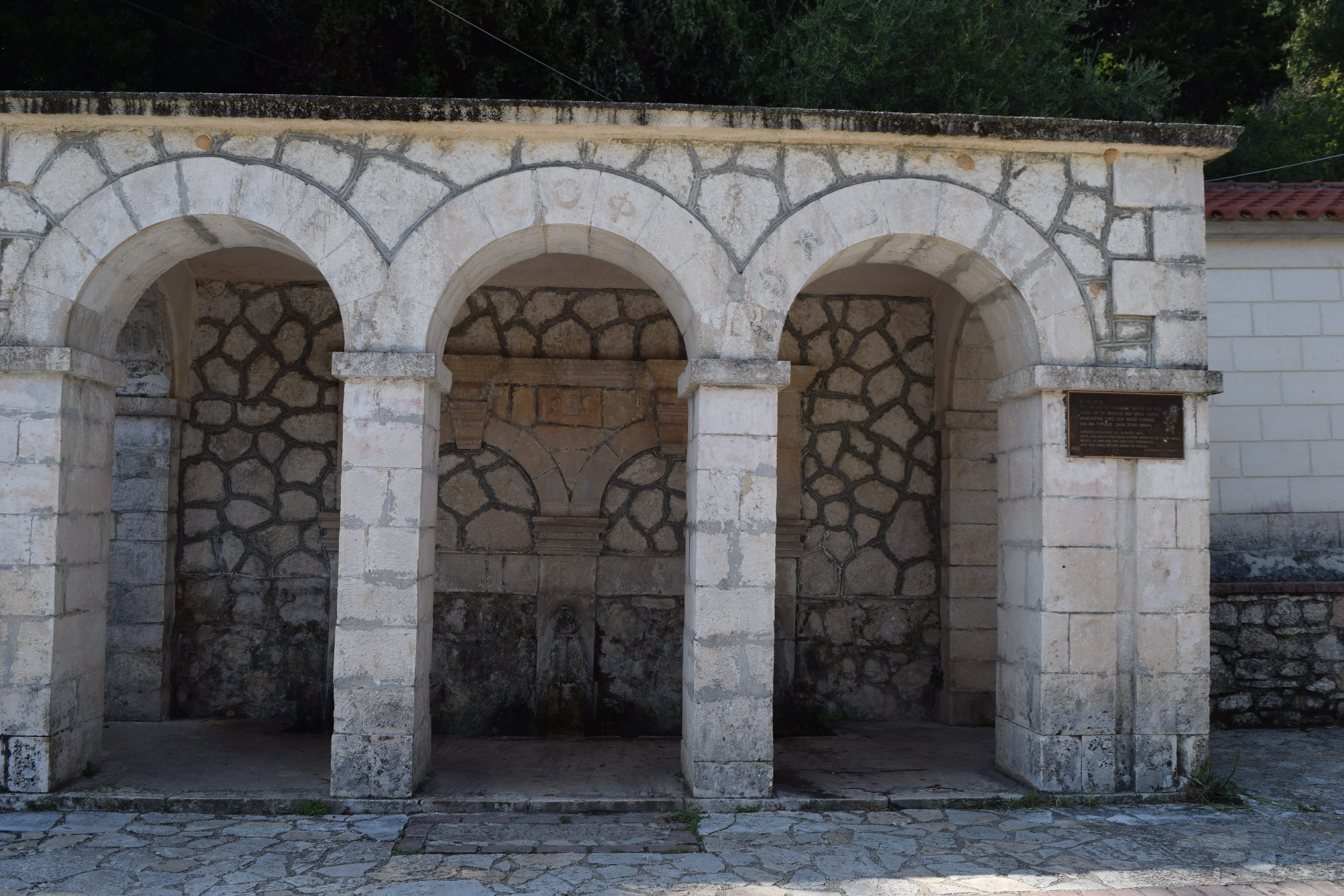 a stone archway with columns