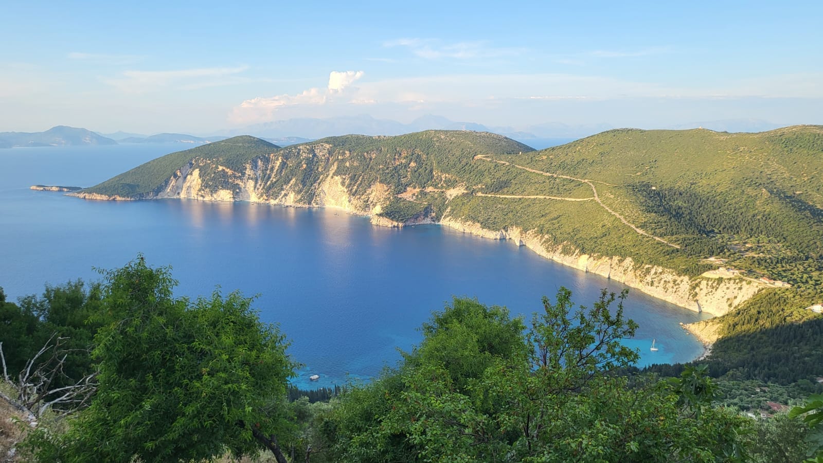 a body of water surrounded by hills