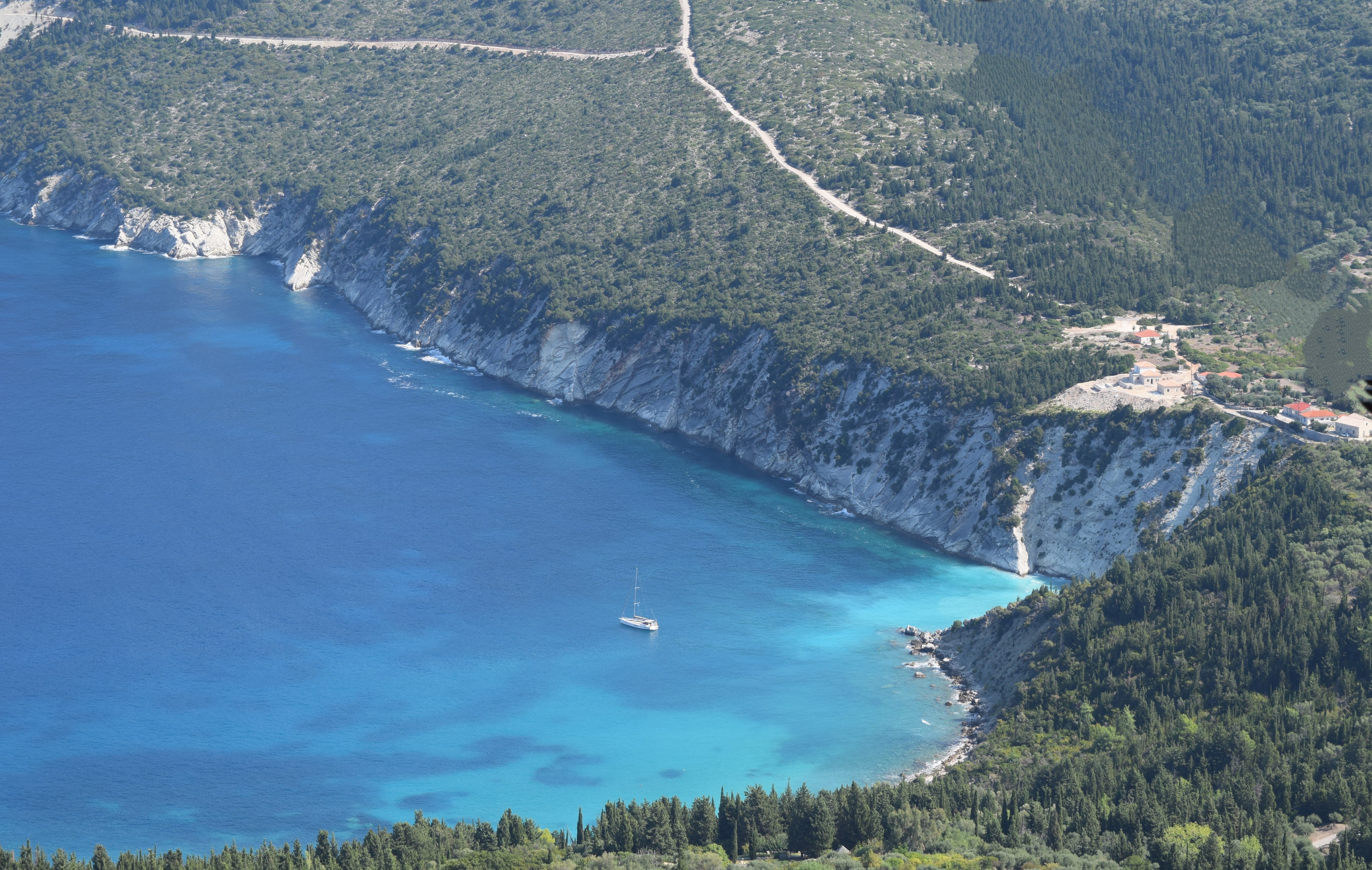 a large body of water with a boat in it