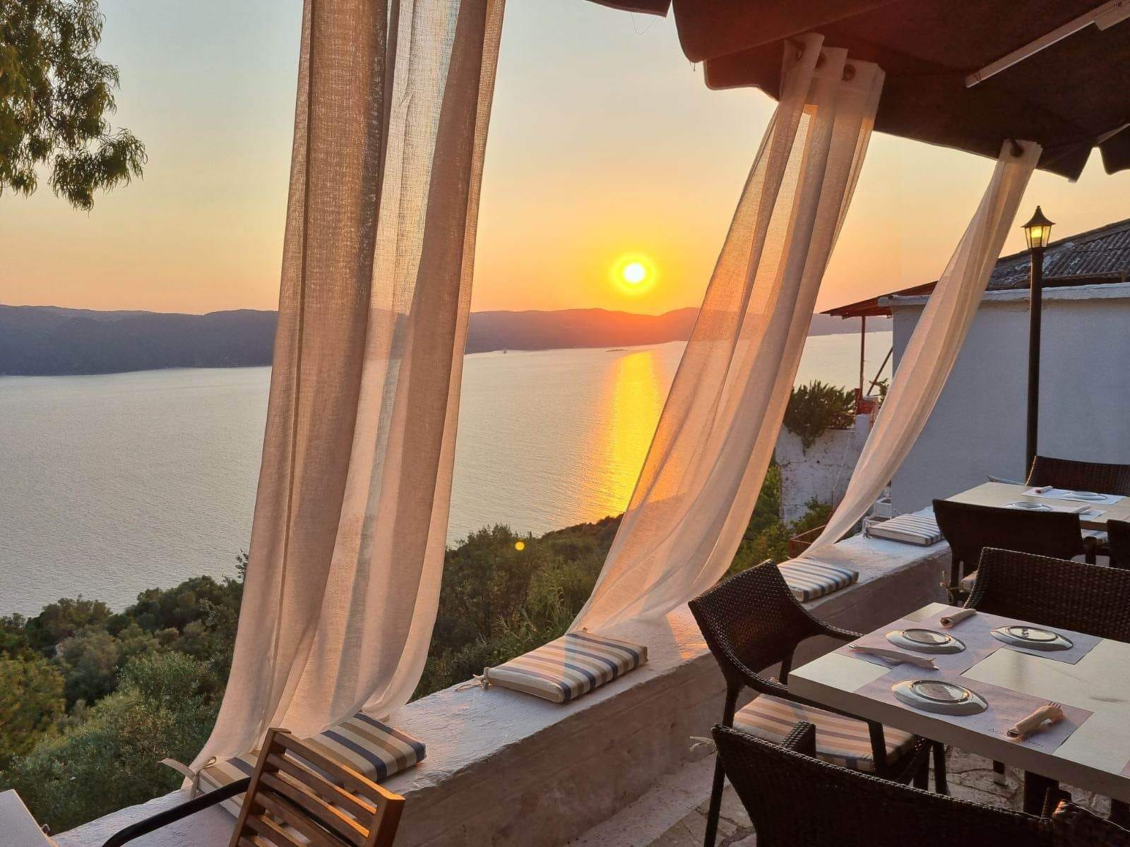 a table and chairs on a deck