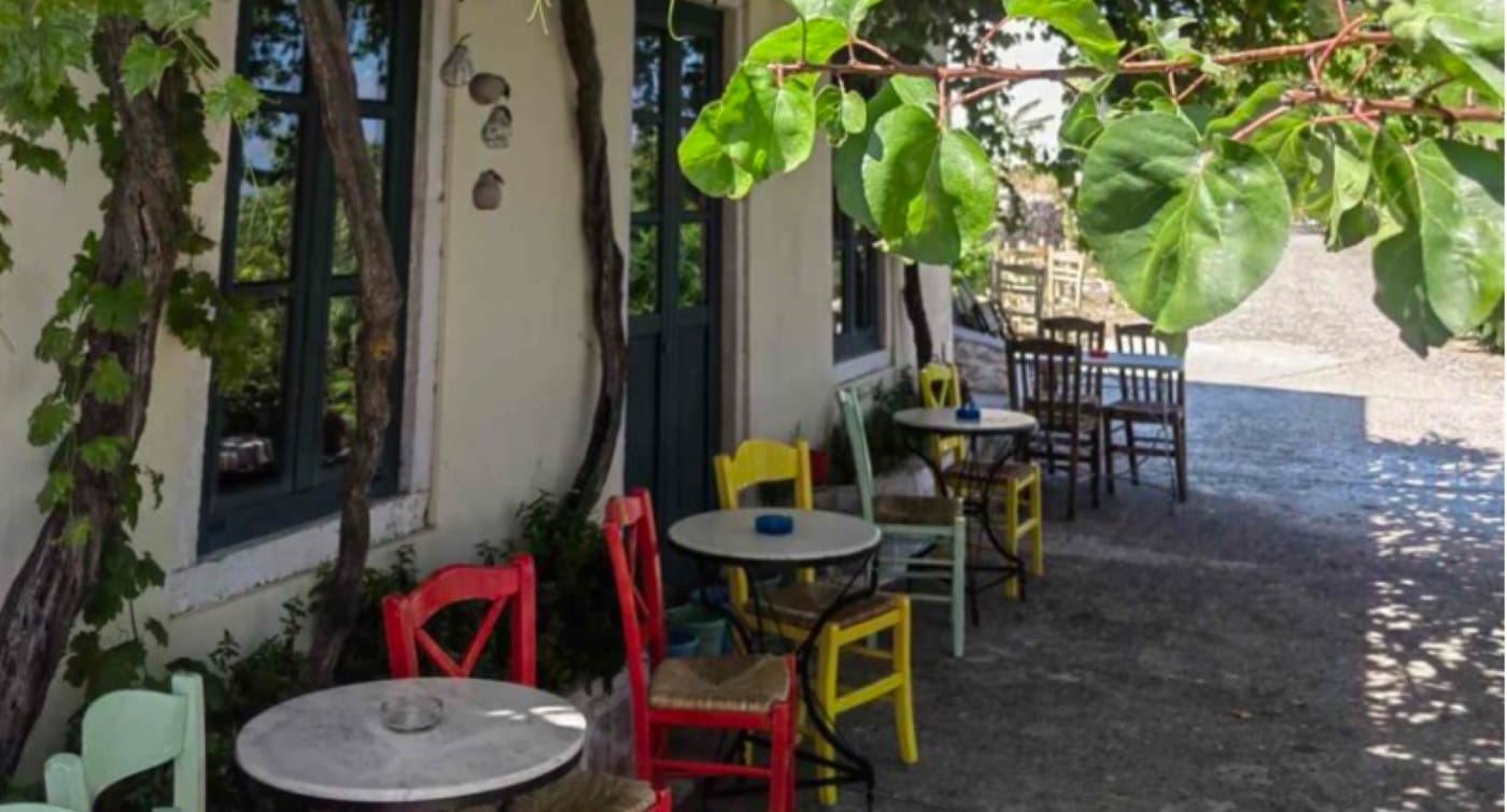 a patio with tables and chairs