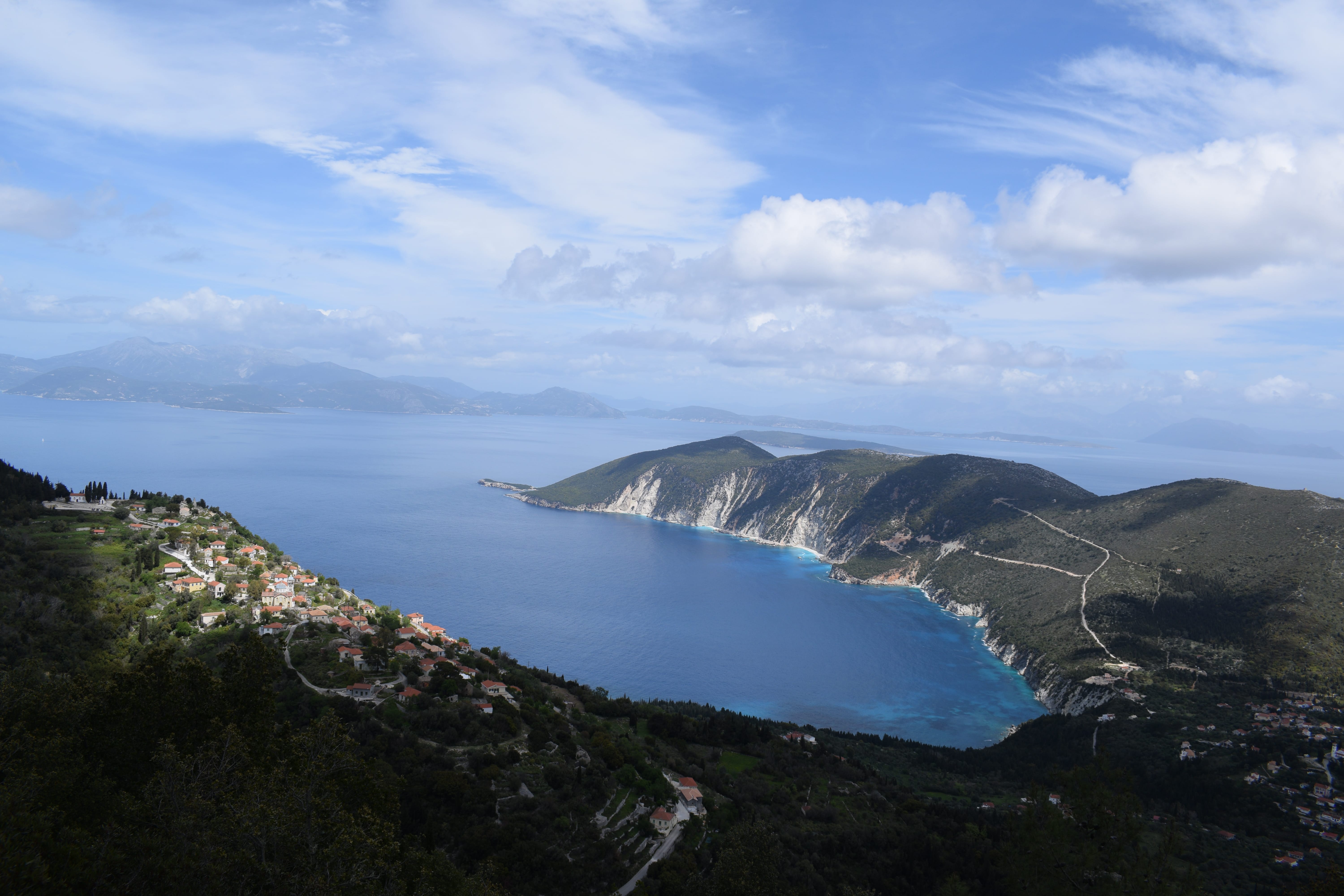 a body of water surrounded by hills
