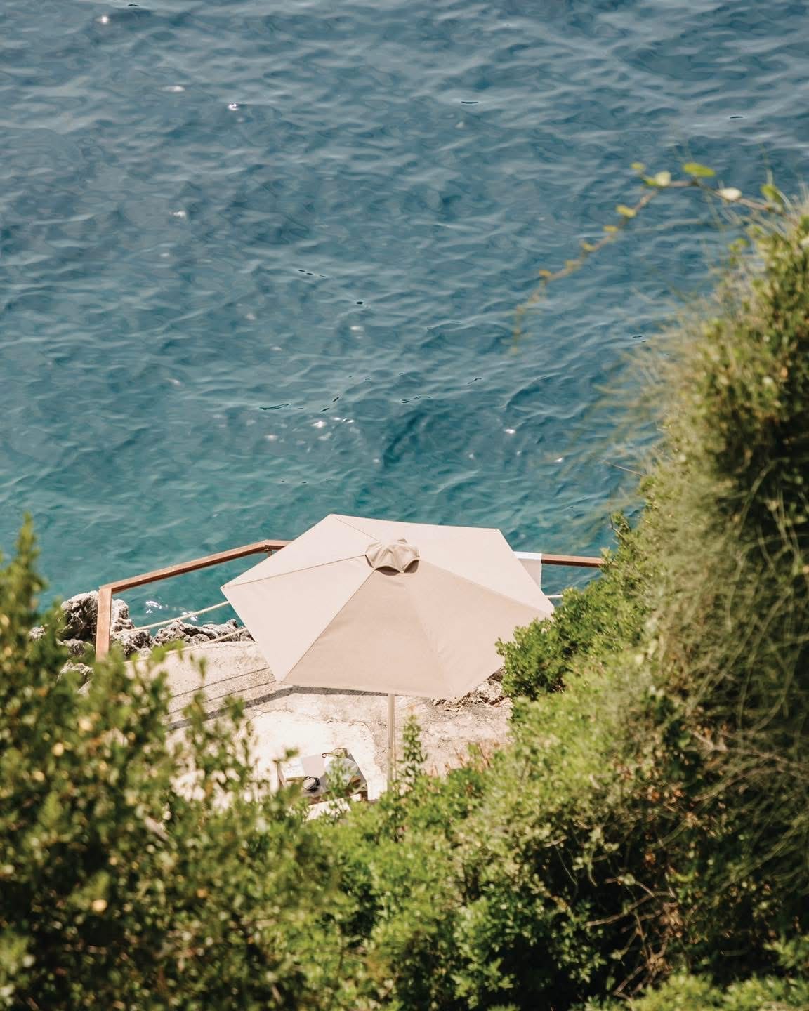 a white building surrounded by trees