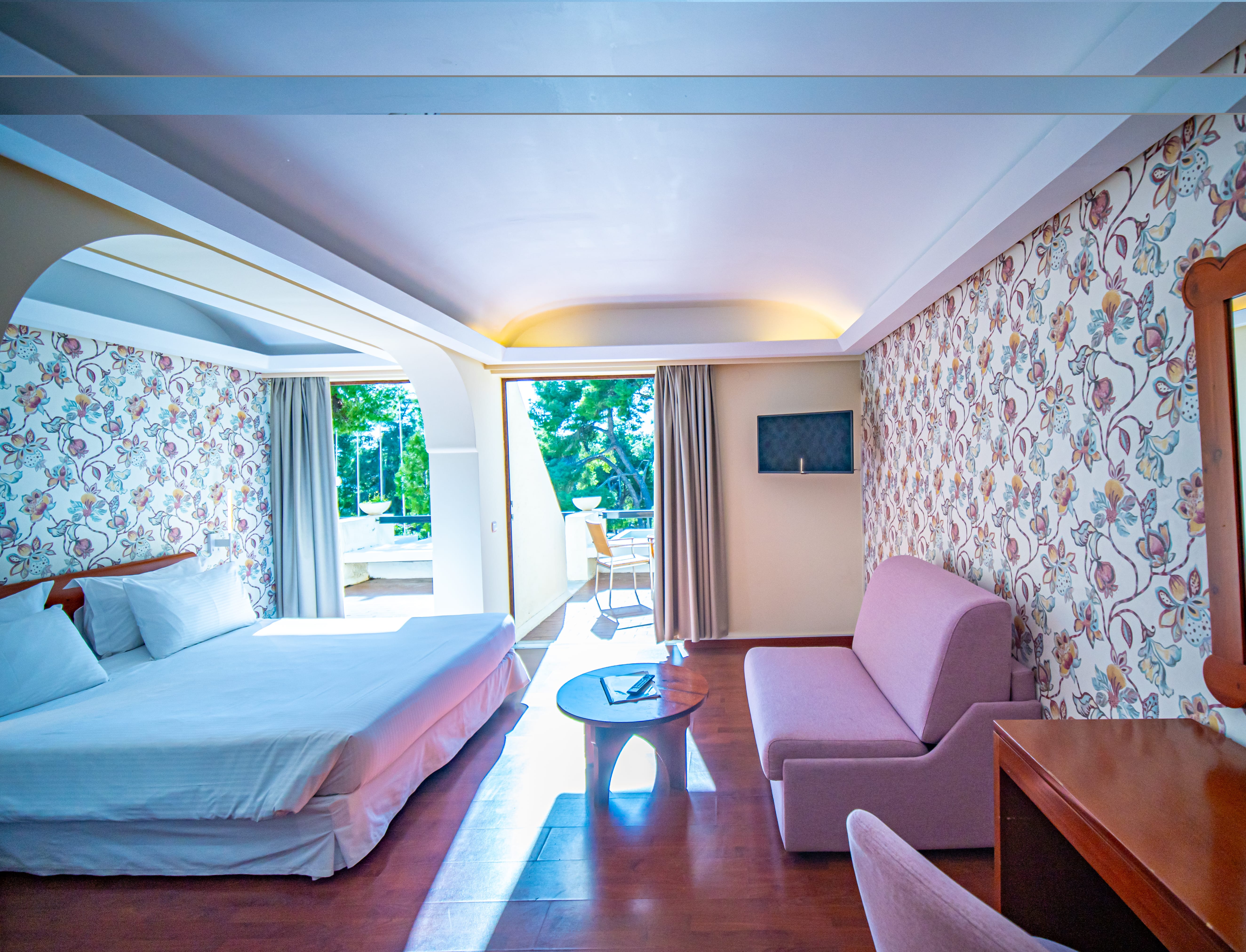 a bedroom with a bed and a chair