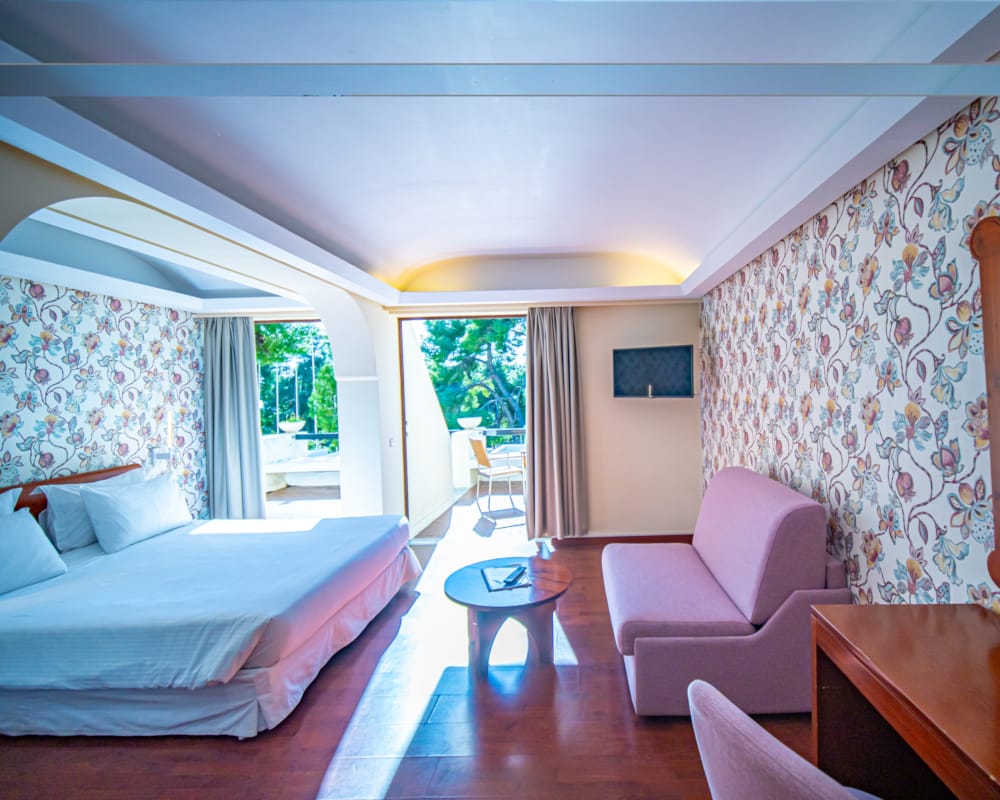 a bedroom with a bed and a chair