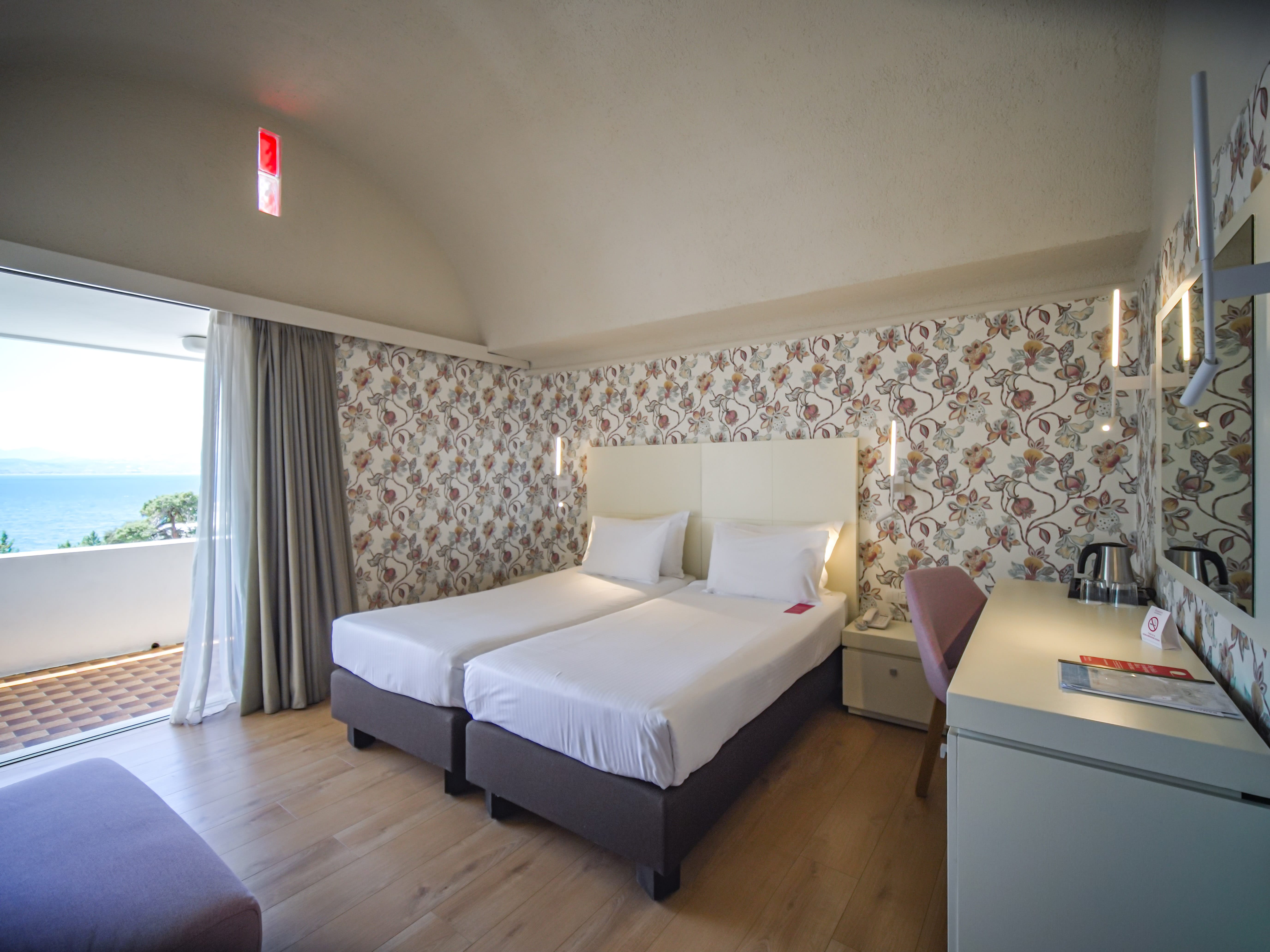 a bedroom with a bed and a desk