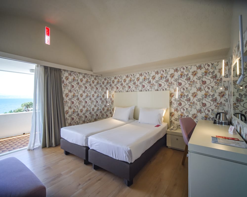 a bedroom with a bed and a desk