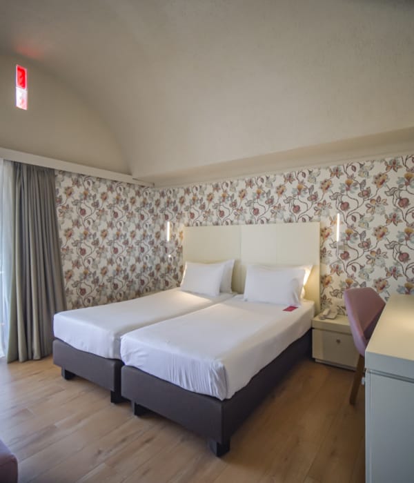 a bedroom with a bed and a desk