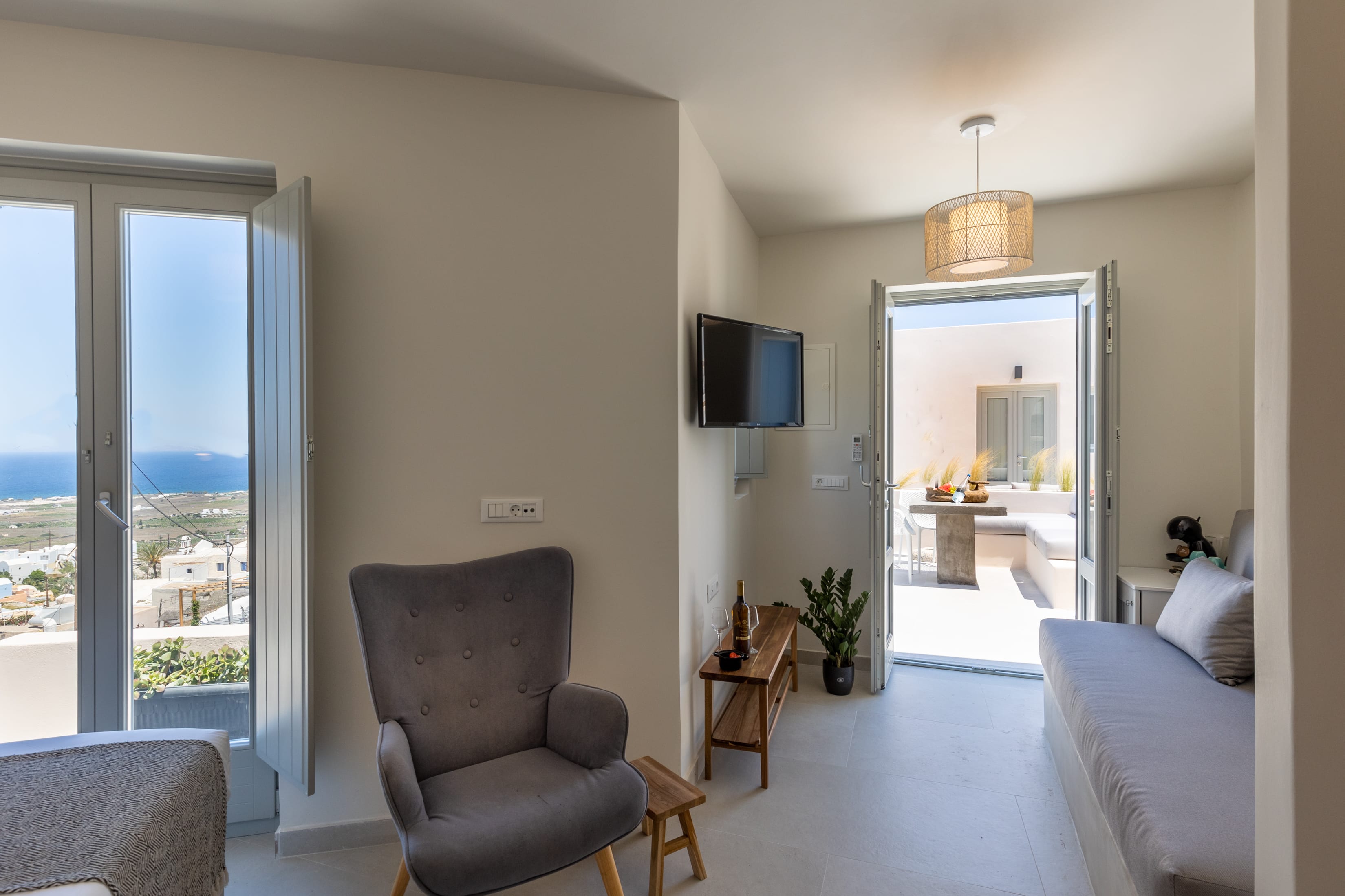 a living room with a tv and couches