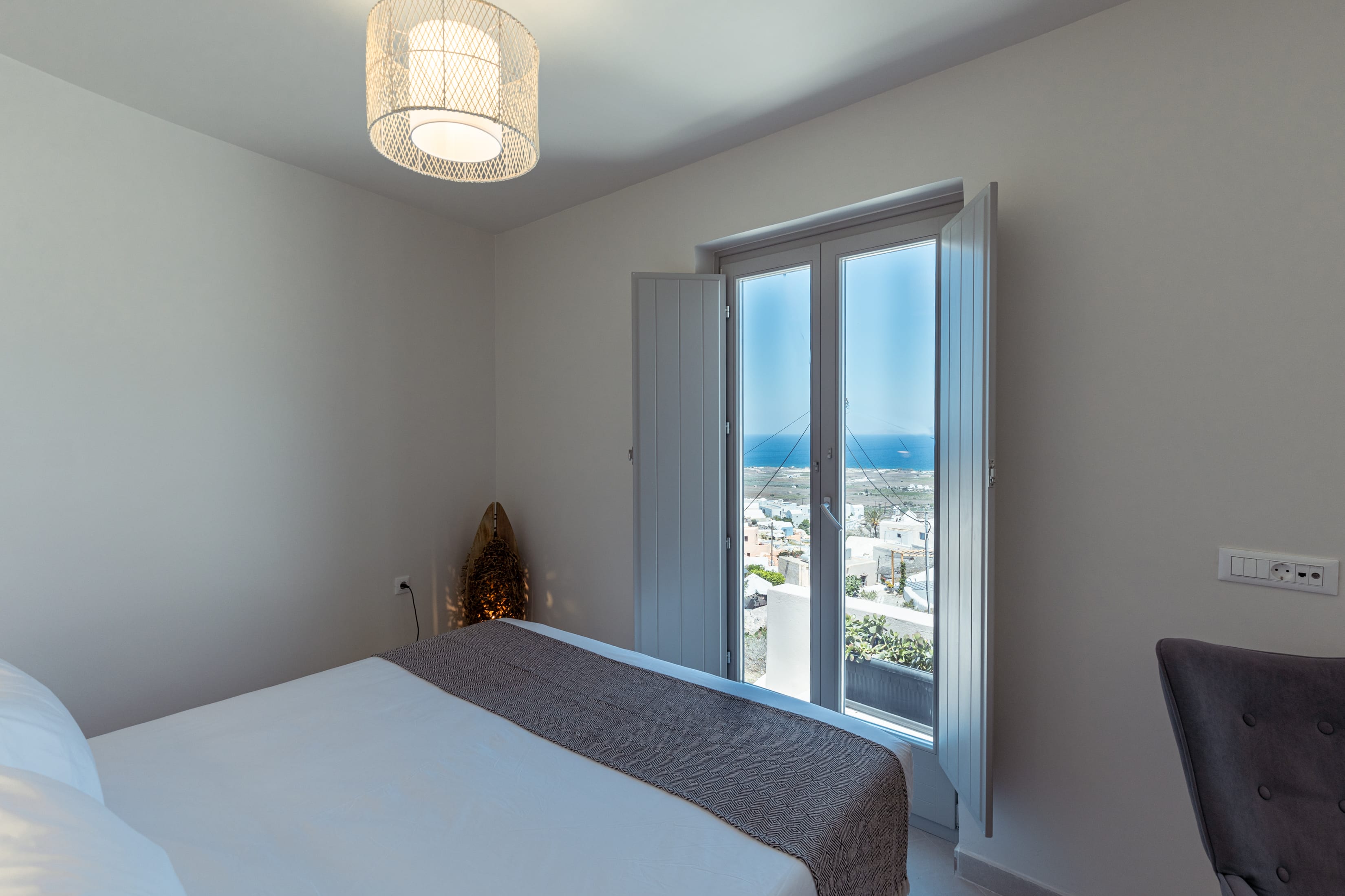 a bedroom with a large window