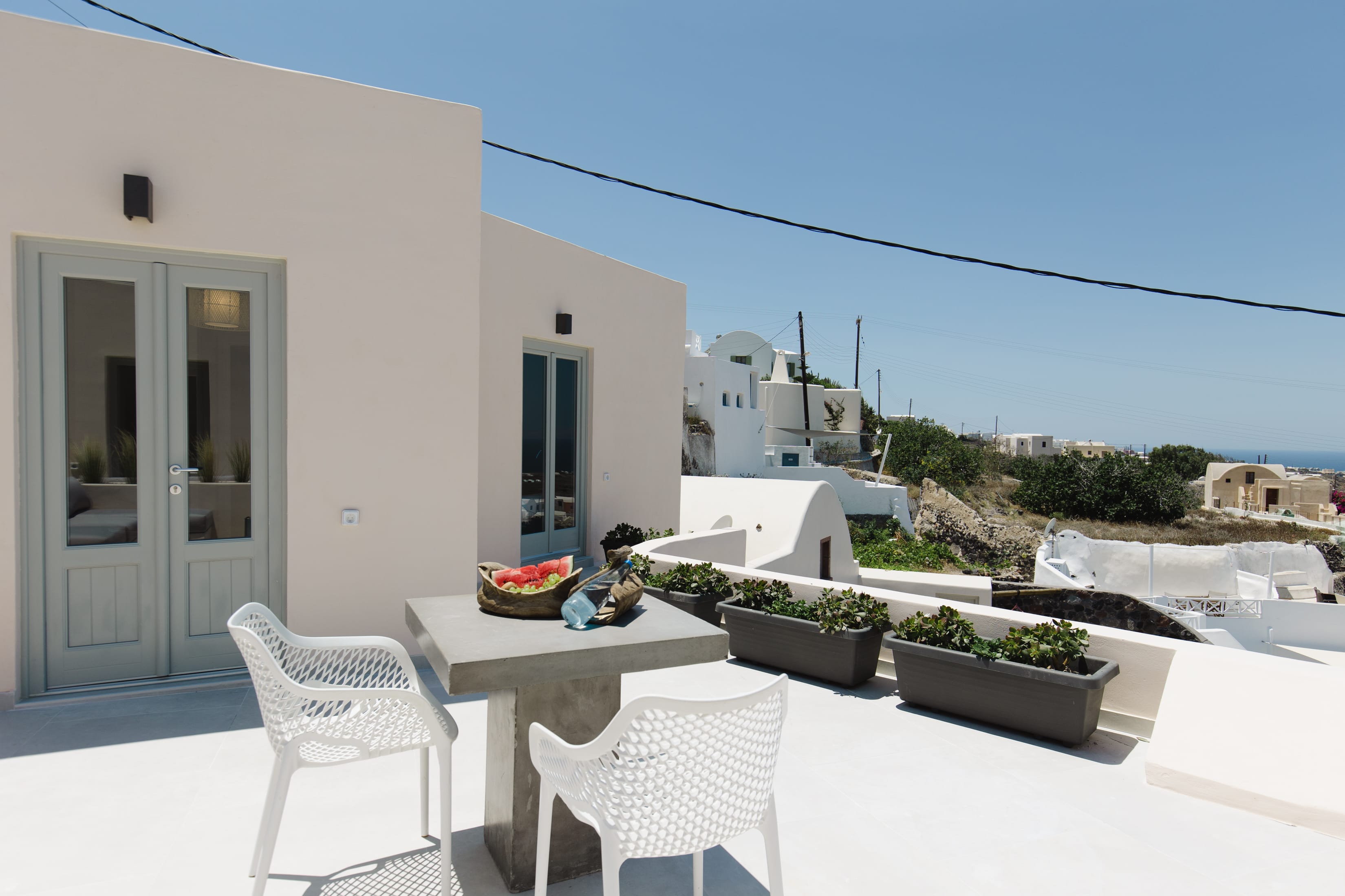 a patio with tables and chairs