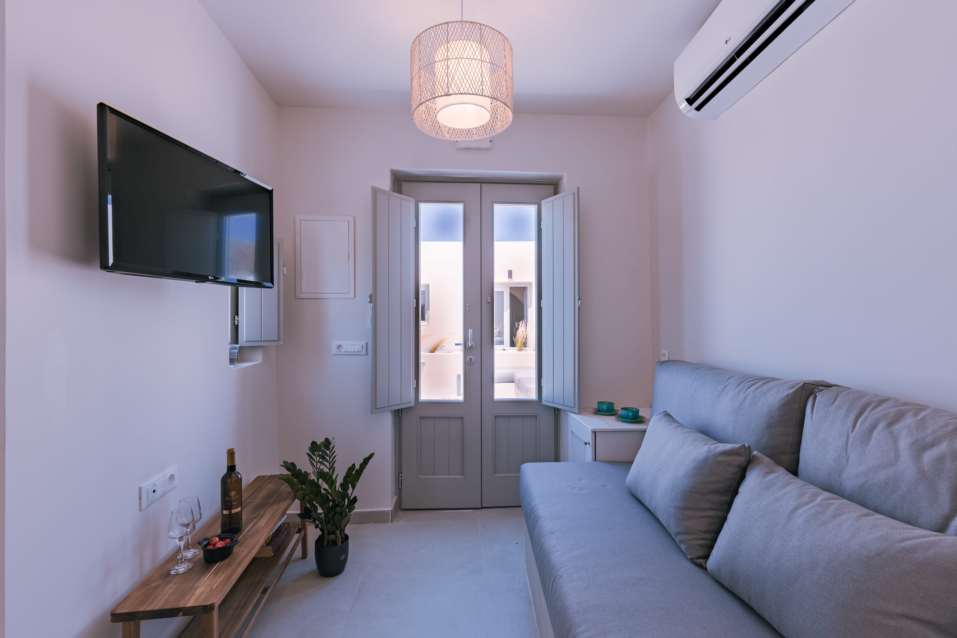 a living room with a couch and a tv