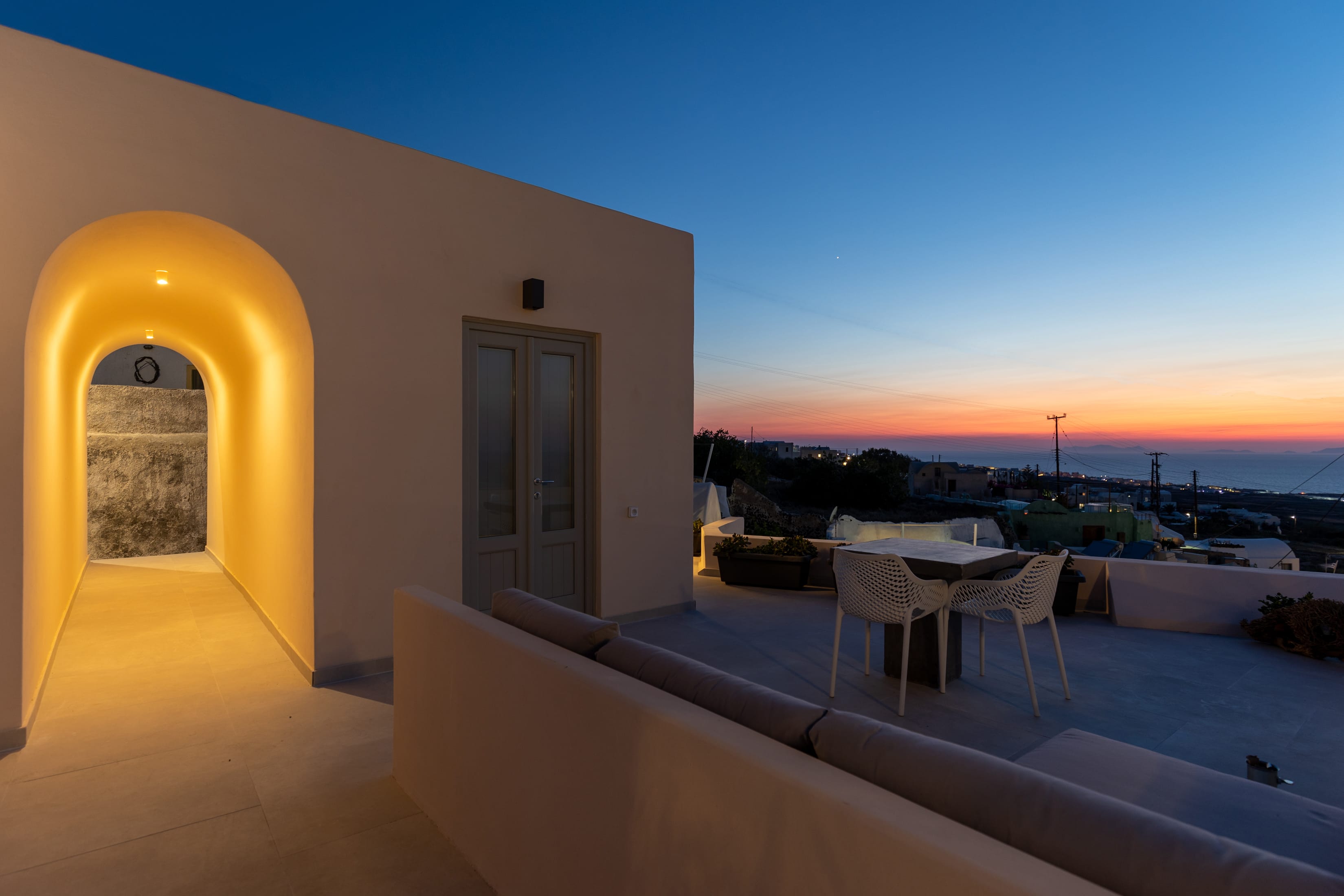 a building with tables and chairs outside