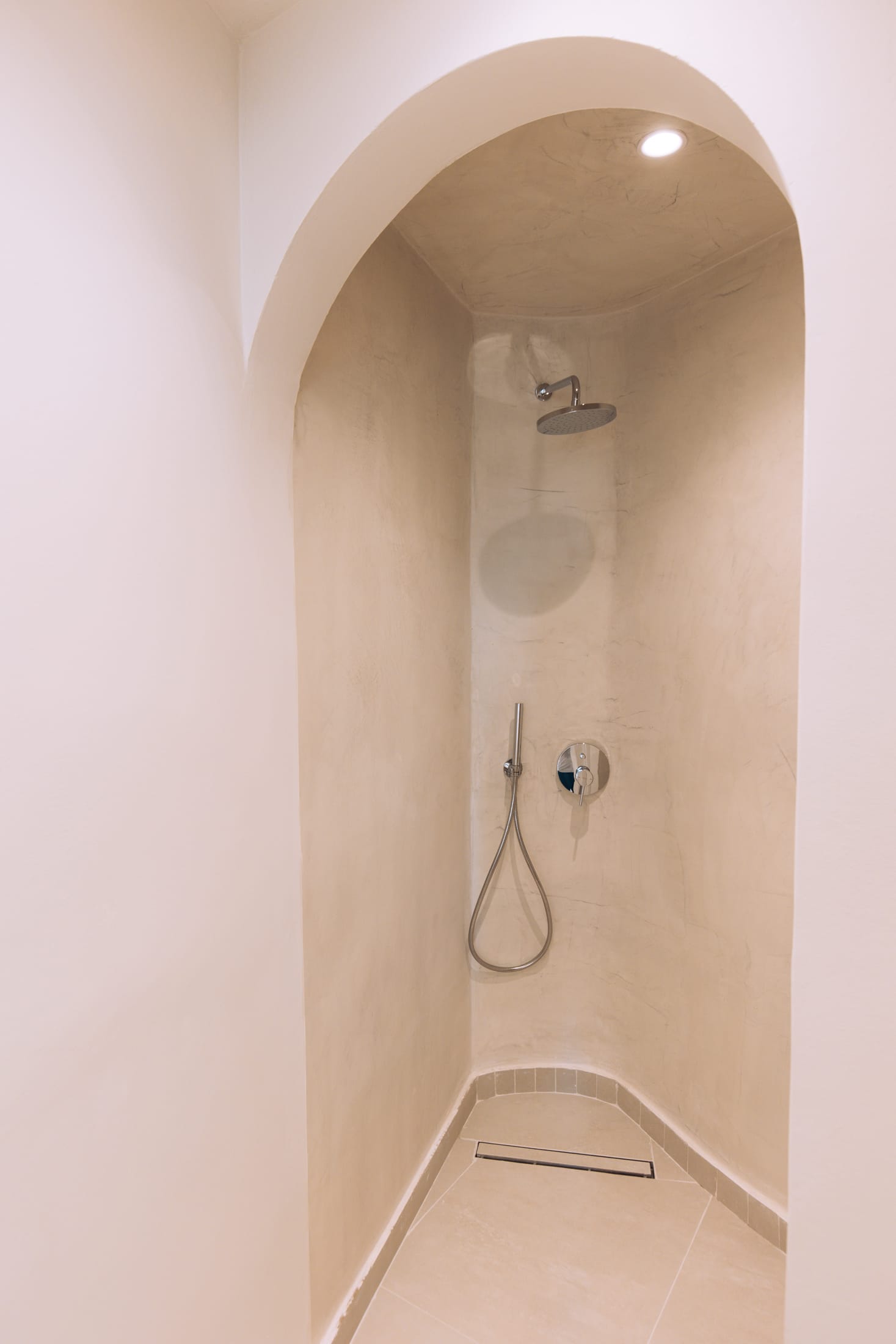 a shower with a light above it