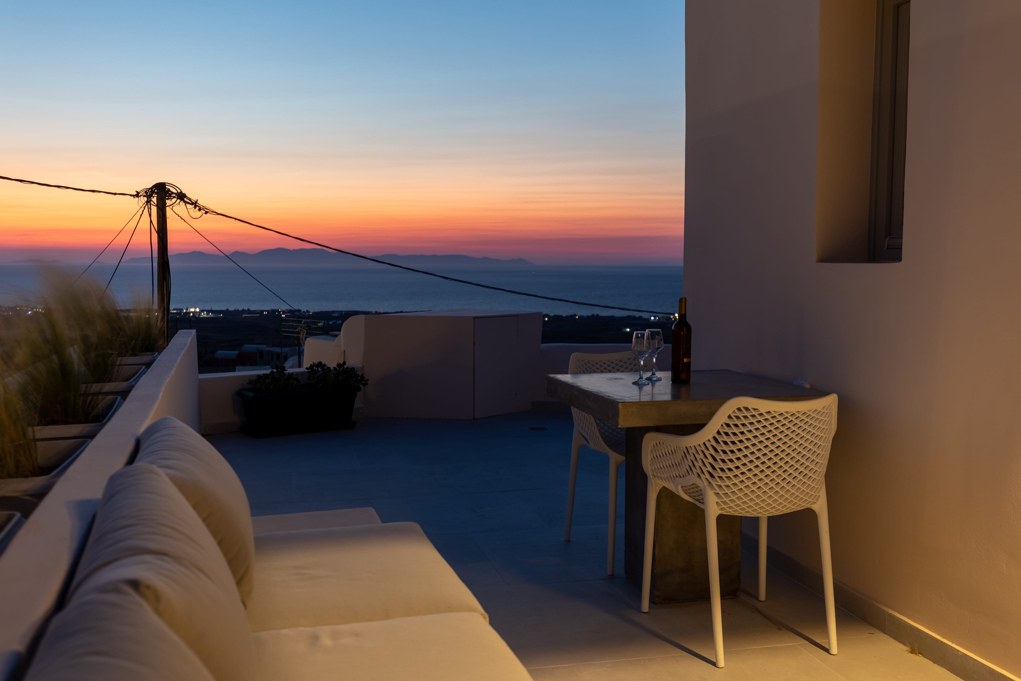 a table and chairs on a balcony