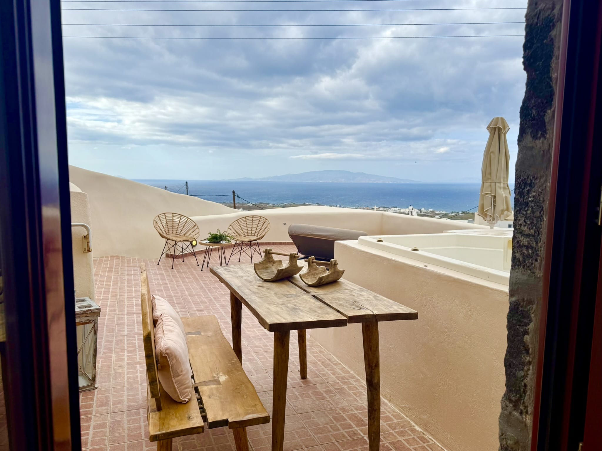 a table and chairs on a balcony