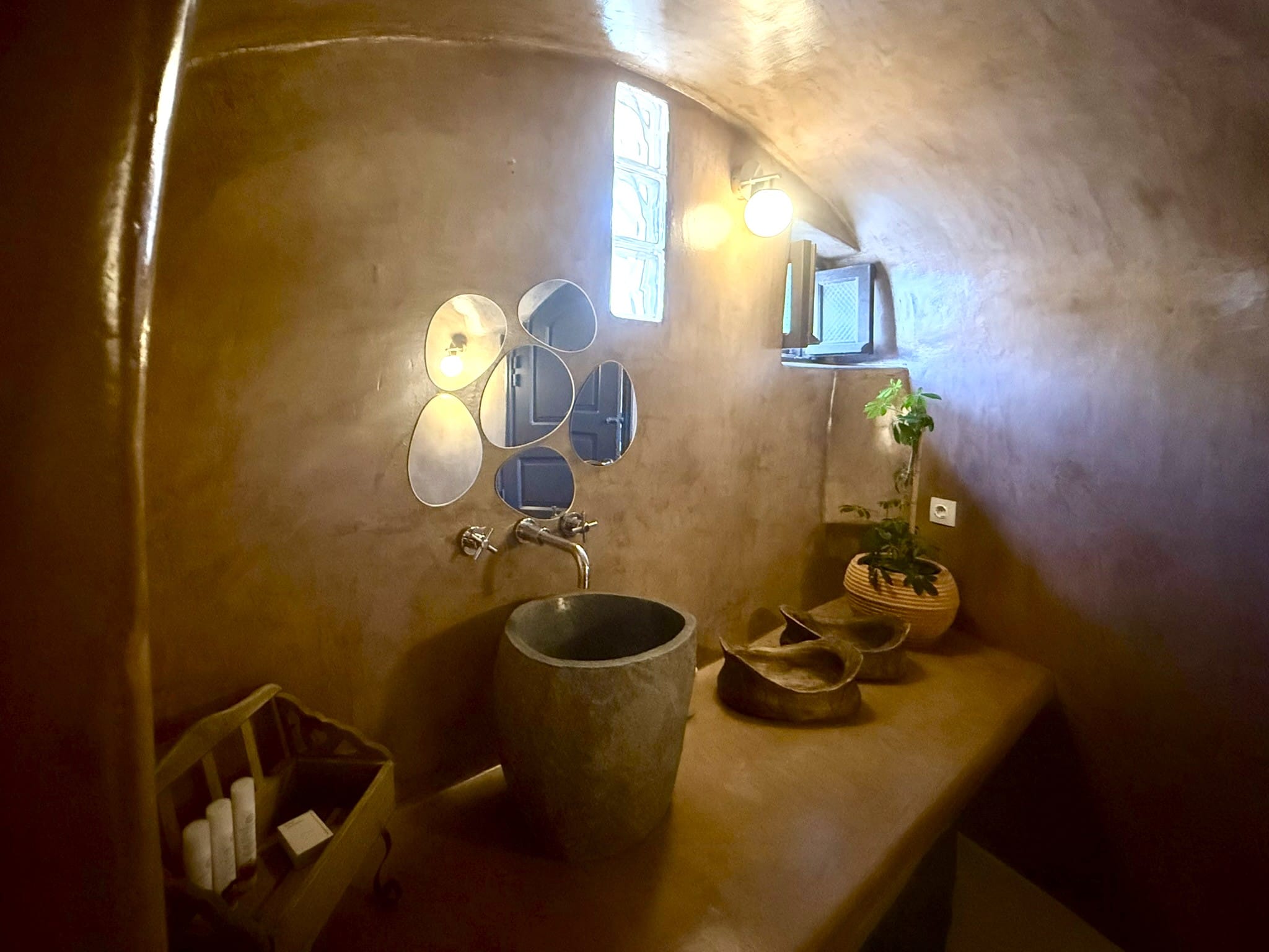 a bathroom with a mirror and a sink