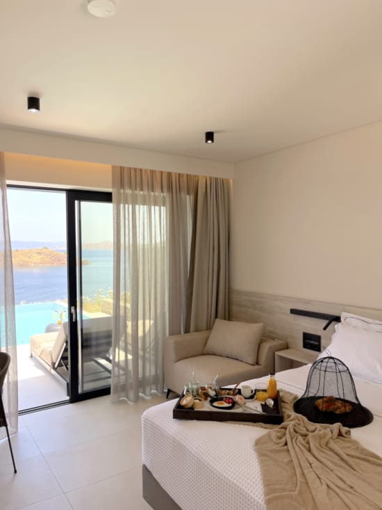 a bedroom with a large glass door