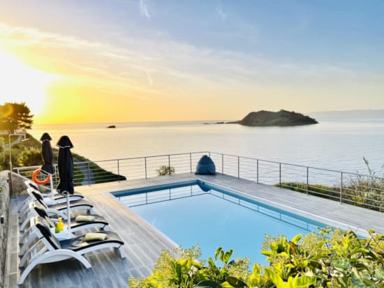 a pool next to a beach
