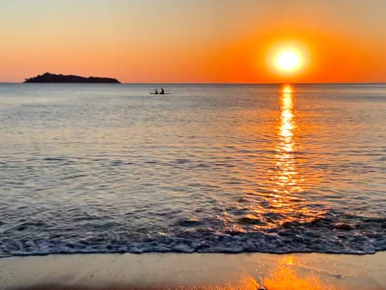 a sunset over a body of water