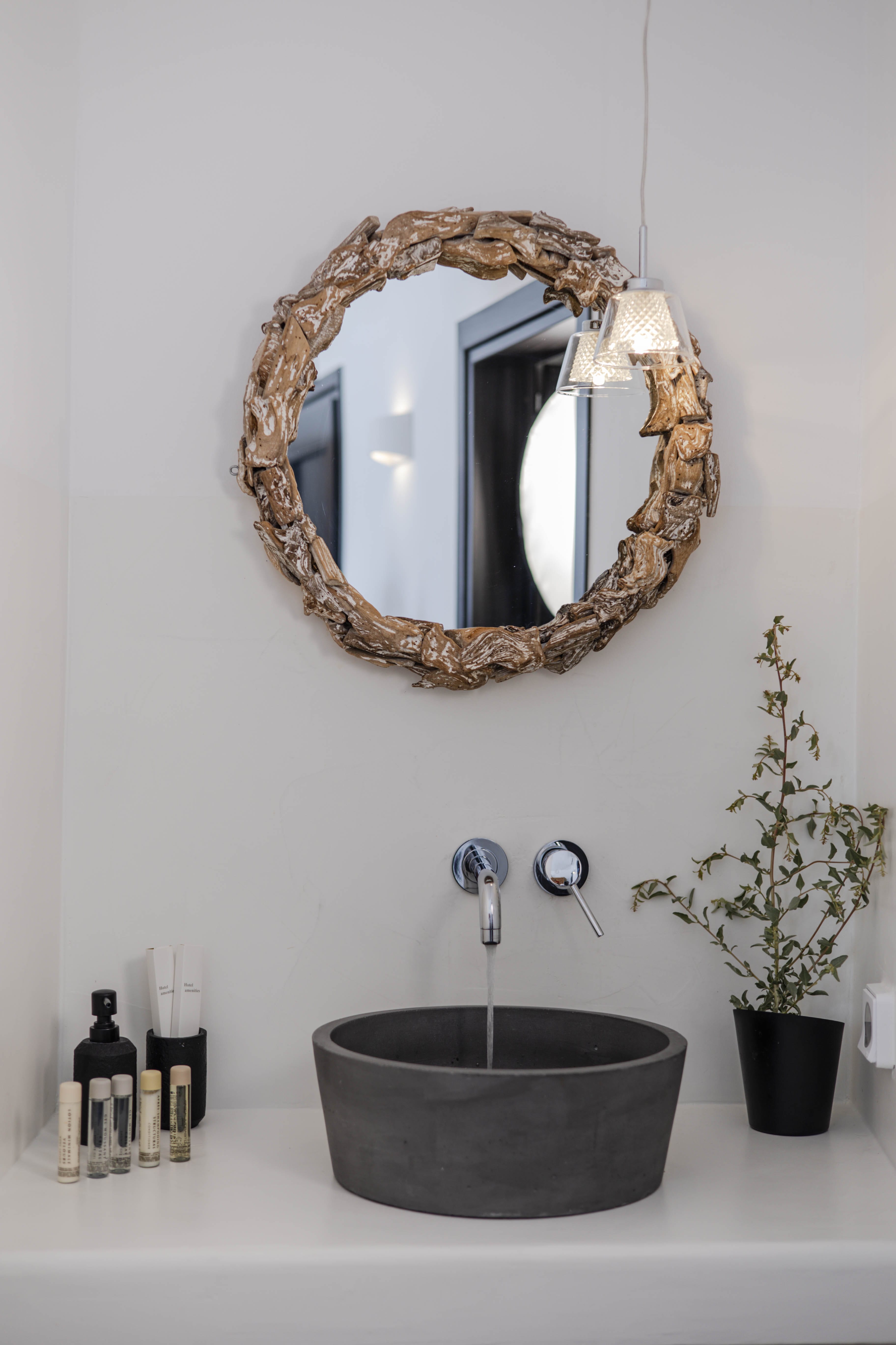 a bathroom sink with a mirror above it
