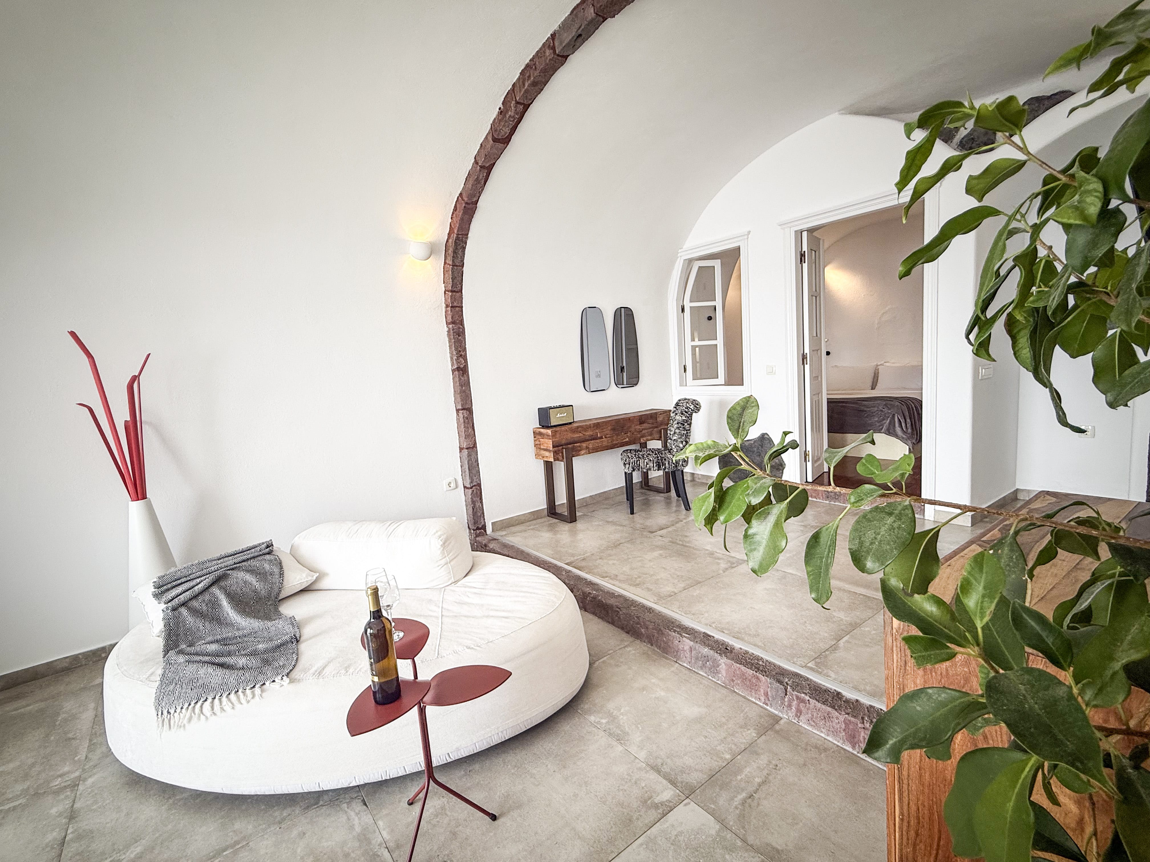 a room with a table and plants