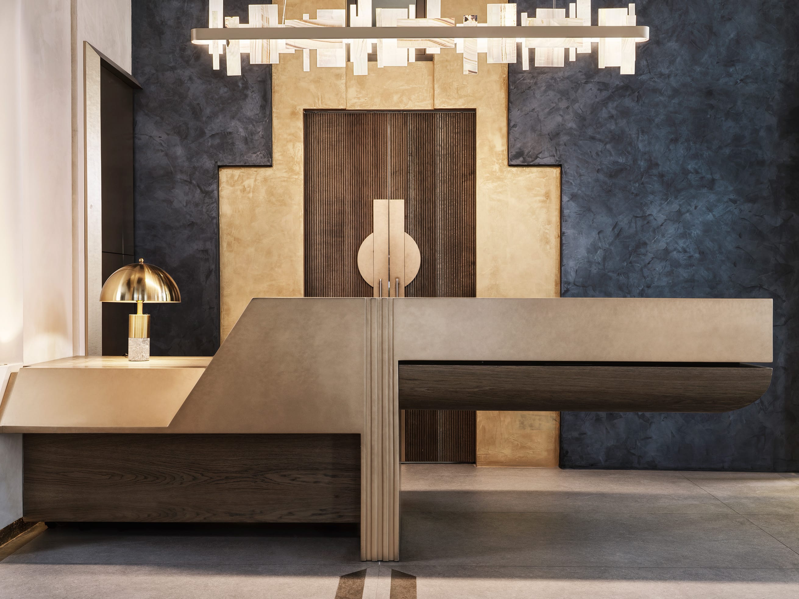 a room with a desk and a lamp