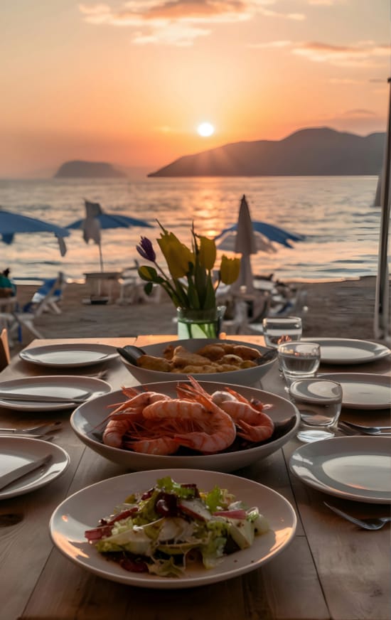 a table with plates of food and glasses on it